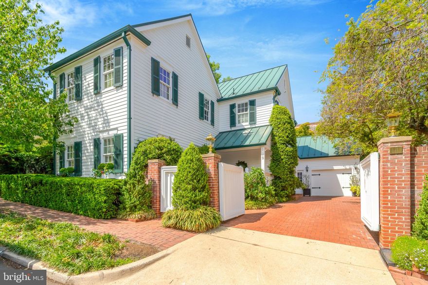 Welcome to 119 Wolfe Street, a distinguished residence located in the heart of Old Town Alexandria, Virginia. This exceptional property offers the rare combination of ultimate privacy and proximity to the scenic Potomac River, just one block away. Spanning 5,884 square feet, this fully detached home is a unique find in Old Town, boasting a gated driveway and garage—an uncommon convenience in this historic area.  Upon entering, you are greeted by a spacious foyer with a large coat closet, setting the tone for the elegant yet comfortable atmosphere that permeates the home. The main level features a great circular flow, ideal for both entertaining and everyday living. The grand dining room includes a charming window seat, adding a touch of character to the home. The updated kitchen is equipped full-size separate Sub-Zero refrigerator and freezer, double ovens, and quartz counters. The breakfast area features a wall of windows overlooking the beautifully landscaped back garden, providing an abundance of natural light.  This residence comprises six generously sized bedrooms and six bathrooms, including four full and two half baths. The primary bedroom offers access to a spectacular roof deck with a new roof and decking. An elevator services all three levels of the home, ensuring ease of movement throughout.  The lower level is fully finished and includes a spacious guest suite with a cozy built-in bed, offering comfort and privacy for visitors. Additional amenities include three fireplaces, enhancing the warmth and ambiance of the home. The scullery or butler's pantry off the kitchen is a luxurious space, ideal for culinary enthusiasts.  Outdoor living is equally impressive, with a serene patio featuring a built-in gas grill, perfect for alfresco dining and entertaining. The gorgeous garden provides a tranquil retreat, while the covered front porch entry welcomes you home.  This property is not historic, yet it embodies the charm and elegance associated with Old Town Alexandria. Its unique attributes, such as the gated driveway and garage, make it a rare offering in this sought-after neighborhood. With its prime location, exceptional privacy, and luxurious amenities, 119 Wolfe Street is a remarkable opportunity for discerning buyers seeking a sophisticated lifestyle in a vibrant community.  Explore the possibilities of owning this exquisite home, where elegance meets comfort in one of Alexandria's most desirable locations.