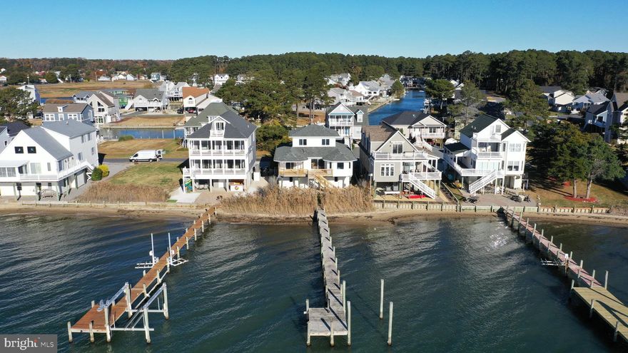 ***Chincoteague Bayside Dream*** This beautiful bayfront home recently had several improvements done. The main living level has all new LVP flooring, new LED lights, new ceiling fans, and a new bathroom vanity. Other improvements include, new roof, new 2-zone HVAC, and a new back deck. The main level features front and rear decks, an open floor plan, with waterfront dining area, a primary suite that walks out to a waterfront deck, a walk-in closet, and a private bathroom as well. There is another bedroom and a full bathroom on this level. The top floor features 2 waterside bedrooms and a third full bathroom. This home is a dream with 2 spacious garages, center storage room, private pier and sooo much with all of the community amenities. Don't miss out on this one.