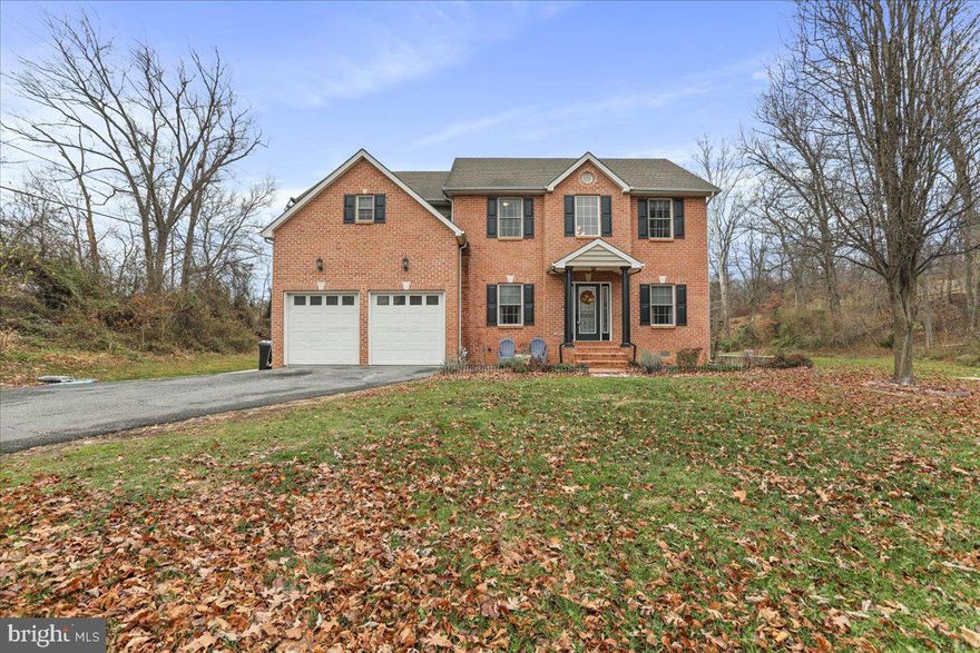 Welcome home to this stunning colonial featuring most of the must haves, including NO HOA! This prestigious five bedroom, three full bath well appointed home sits on over an acre of flat yard space. The best part? There is nothing behind you but beautiful, protected nature.  Let's step inside, shall we? Upon entry, a beautiful  foyer welcomes you in, and leads you to your gorgeous. oversized living room.  The open concept kitchen with an oversized island is perfect for entertaining and meal prep.  The kitchen also has newer  Stainless-steel appliances, a gas stove, recess lighting,  a large pantry and plenty of cabinetry. The large dining room is the  perfect size to host family gatherings this year and many years to come. Also on the main level, you will find a flex room perfect for a dedicated office space, a full bathroom, and a bedroom- that could be used as a workout room! Upstairs has an additional open living space, perfect for movie night, gaming, and so much more! The primary suite is stunningly massive, with an ensuite that features double sinks, a soaking tub, and a large stand-in shower. The primary closet is HUGE! Also upstairs you will find three additional amble sized bedrooms, an additional full bathroom and a laundry room conveniently located on the bedroom level! This is truly a dream home! Stepping onto the covered deck you will find dual staircases leading you to your backyard oasis! This is the perfect place to unwind, enjoy a nice cup of coffee or wine, and appreciate the beauty nature has in store. The ground level patios are perfect for firepits and family time. The storage shed is amble size to hold lawn mowers, and additional storage. The best part- this home is minutes from coffee shops, commuter routes, doctor offices and the DMV.  The country setting and the convenient location makes this home so special!