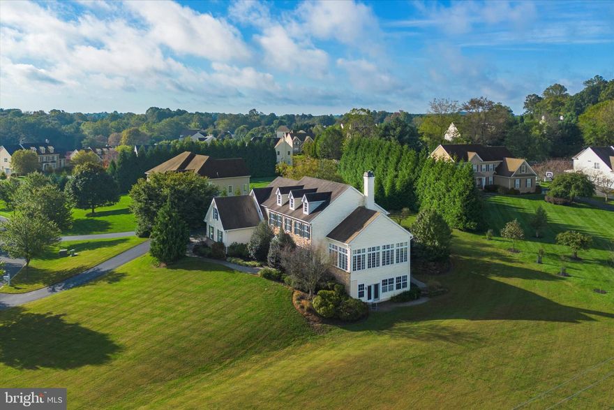 Welcome to 303 Hyatt — the original Wilkinson model home, crafted with timeless detail and every upgrade in mind. In this spacious 4-bedroom, 4.5-bath, 4,361 sq. ft. residence, you’ll find elegant design and thoughtful craftsmanship at every turn. The home sits high on an incline above the street on a picturesque corner lot, offering privacy, presence, and sweeping views from its 1.2-acre setting in a sought-after community.

Built in 2008, it showcases 12-foot ceilings, crown molding, recessed lighting, a built-in speaker system, and hard-wired windows throughout. The main level is highlighted by elegant paneled box columns that frame the open-concept layout — perfect for gatherings and entertaining — along with bullnose wall corners that soften transitions and add a touch of modern refinement.

The first-floor office features full-wall raised panel wainscoting and custom millwork, creating a polished and professional setting ideal for work or study. Nearby, the conservatory provides a unique vantage point to take in incredible sunsets, making it a signature space in this remarkable home.

The kitchen is a chef’s dream, featuring KitchenAid appliances, a GE gas range, granite countertops, and an expansive gathering room. Both formal and casual spaces flow seamlessly, making the home perfect for entertaining on any scale.

Upstairs, the owner’s suite is a private retreat with a vaulted ceiling that enhances the sense of openness and light, his-and-hers walk-in closets, and a spa-inspired bath complete with dual vanities, a private water closet, and a double shower. 

A fully finished walkout lower level provides an impressive extension of living space — adding approximately 1,800 sq. ft. not included in the listed square footage. Designed with recessed lighting, a full bath, kitchenette, and an office with built-ins, it offers exceptional flexibility for an in-law suite, home business, or recreation area.

Outside, the elevated property enhances curb appeal and creates a serene, private setting. The back patio is beautifully hardscaped with impressive natural stonework and bordered by mature trees, creating a stunning outdoor retreat perfect for entertaining, relaxing, or simply taking in the peaceful surroundings.

Additional features include a three-car garage, a three-zone HVAC system, and abundant storage throughout.

This home blends elegance and functionality — a standout property designed for both grand entertaining and comfortable everyday living.