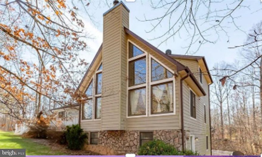 Priced below the most recent appraisal, offering buyers a rare opportunity for immediate equity!!!

Lake life is calling—now is your opportunity to answer at an exceptional new price point. Welcome to 7312 Sugar Hollow Road, a beautifully positioned retreat offering privacy, amenities, and effortless access to everything Lake Anna has to offer.

Set on a private 1-acre lot, this home delivers peaceful surroundings just minutes from local dining, local breweries, and Lake Anna State Park. An assigned boat slip (#43) just down the street makes spontaneous lake days and sunset cruises a breeze.

The backyard is built for relaxing and entertaining with a resurfaced in-ground pool, fresh decking, and multiple outdoor living spaces. Inside, you’ll find light-filled living areas, a cozy fireplace, rich finishes, and a well-appointed kitchen with stainless appliances and generous counter space—ideal for gathering.

With four bedrooms and three full baths, there’s plenty of space for guests or extended stays. The primary suite offers a spa-like retreat with soaking tub, while the finished walk-out basement provides flexible space for guests, recreation, or a home office. Two balconies and a large rear deck extend the living space outdoors.

Recent updates include newer HVAC, resurfaced pool, and fresh decking, allowing you to focus on enjoyment rather than projects.

Whether you’re seeking a full-time residence, weekend escape, second home, or short-term rental opportunity, this property offers the location, flexibility, and lifestyle that make Lake Anna so desirable.

Offered at $595,000—ready for immediate enjoyment and your next chapter at the lake.