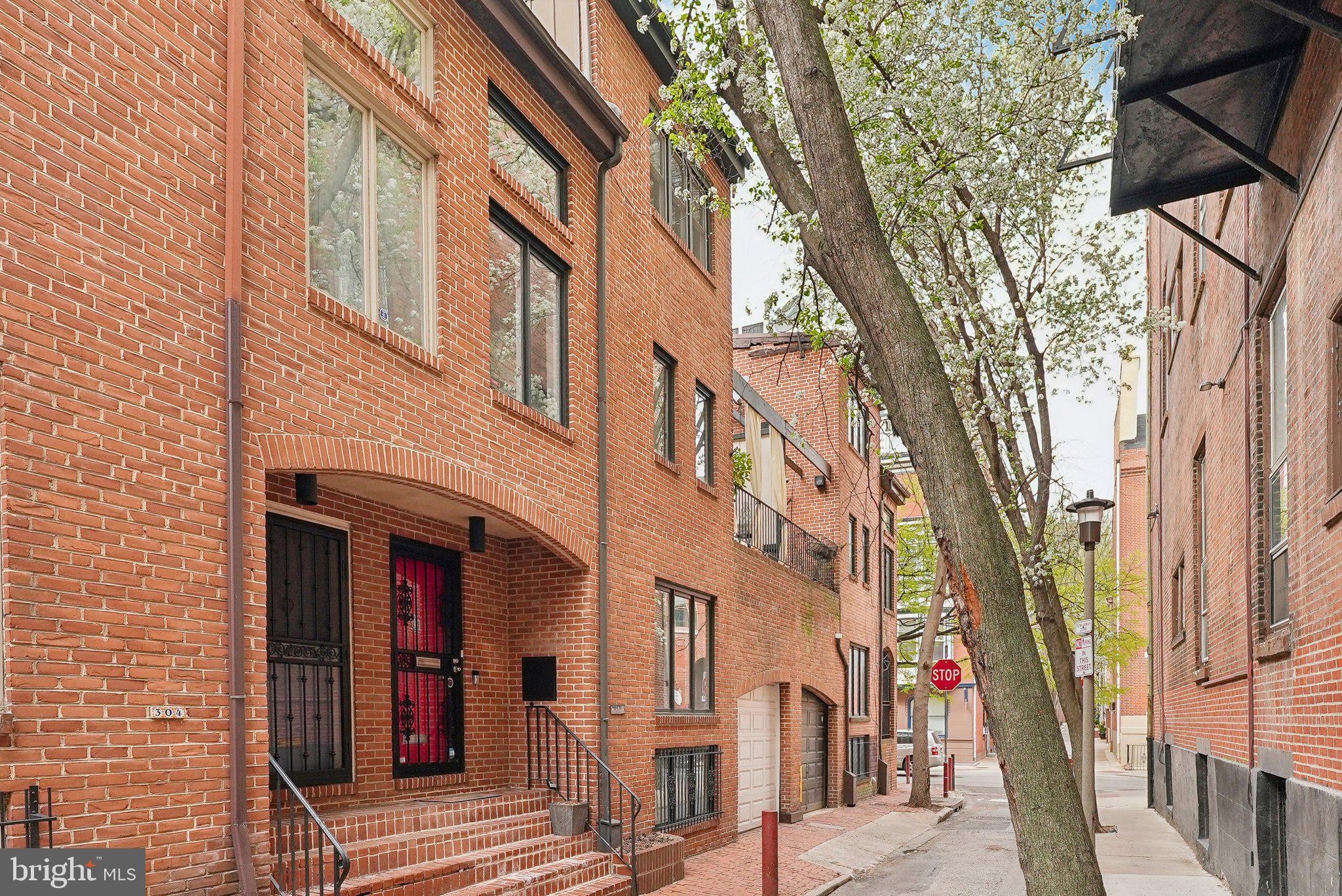 Nestled on a tranquil, tree-lined street in the heart of Washington Square West, this exquisite townhouse at 302 S Quince St promises a blend of sophistication and convenience. Located just a stones throw from Spruce st, this property is a flawless fusion of modern amenities and enchanting neighborhood charm with PARKING.
Enter into a spacious, light-filled living room with a wood-burning fireplace and plenty of room for seating and entertaining. Downstairs you will find a bright and completely updated kitchen with stainless steel appliances, coffee bar and a large dining area. A separate laundry room and half bath are also on this level for added convenience. On second floor you have your first generously sized bedroom with a custom walk-in closet. Through this room also provides access to your large private deck overlooking Quince St. You also have a full hall bathroom, and an additional sun-drenched flex space with plenty of opportunity. The third floor houses the primary suite, walk-in closet and updated en-suite bathroom.
Adding to the appeal is the rarity of garage parking in such a coveted location. Less than three blocks from the Avenue of the Arts, and a leisurely stroll to Washington Square Park, this location is enviable. The neighborhood is alive with an array of coffee shops, restaurants, and cultural venues, providing an unparalleled urban living experience.
For those seeking a blend of modern convenience and timeless charm in Philadelphia, your search ends at 302 S Quince St.