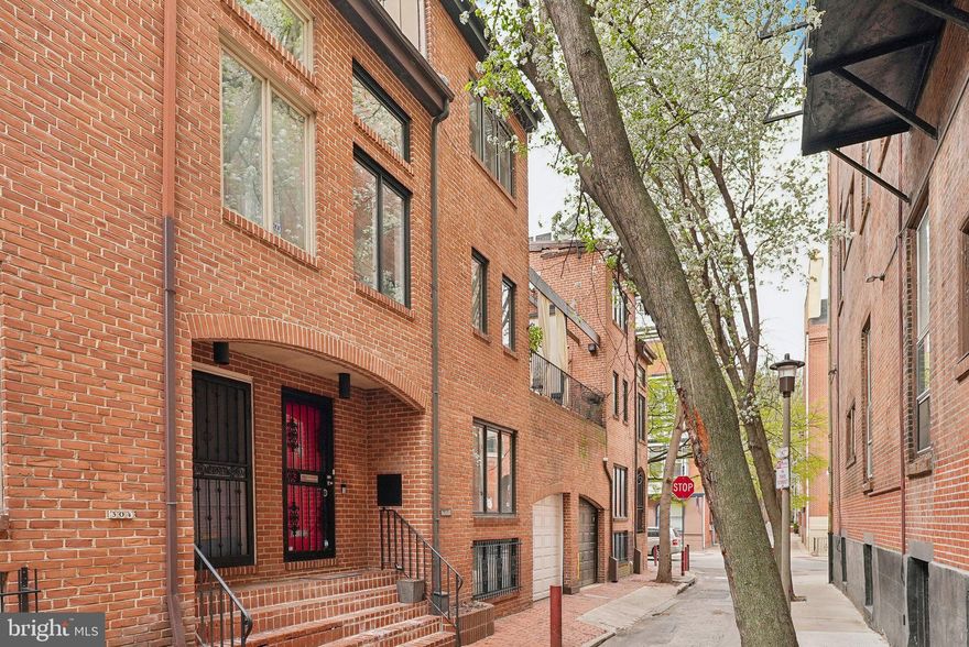 Nestled on a tranquil, tree-lined street in the heart of Washington Square West, this exquisite townhouse at 302 S Quince St promises a blend of sophistication and convenience. Located just a stones throw from Spruce st, this property is a flawless fusion of modern amenities and enchanting neighborhood charm with PARKING.
 
Enter into a spacious, light-filled living room with a wood-burning fireplace and plenty of room for seating and entertaining. Downstairs you will find a bright and completely updated kitchen with stainless steel appliances, coffee bar and a large dining area. A separate laundry room and half bath are also on this level for added convenience. On second floor you have your first generously sized bedroom with a custom walk-in closet.  Through this room also provides access to your large private deck overlooking Quince St. You also have a full hall bathroom, and an additional sun-drenched flex space with plenty of opportunity. The third floor houses the primary suite, walk-in closet and updated en-suite bathroom. 
 
Adding to the appeal is the rarity of garage parking in such a coveted location. Less than three blocks from the Avenue of the Arts, and a leisurely stroll to Washington Square Park, this location is enviable. The neighborhood is alive with an array of coffee shops, restaurants, and cultural venues, providing an unparalleled urban living experience.
 
For those seeking a blend of modern convenience and timeless charm in Philadelphia, your search ends at 302 S Quince St.