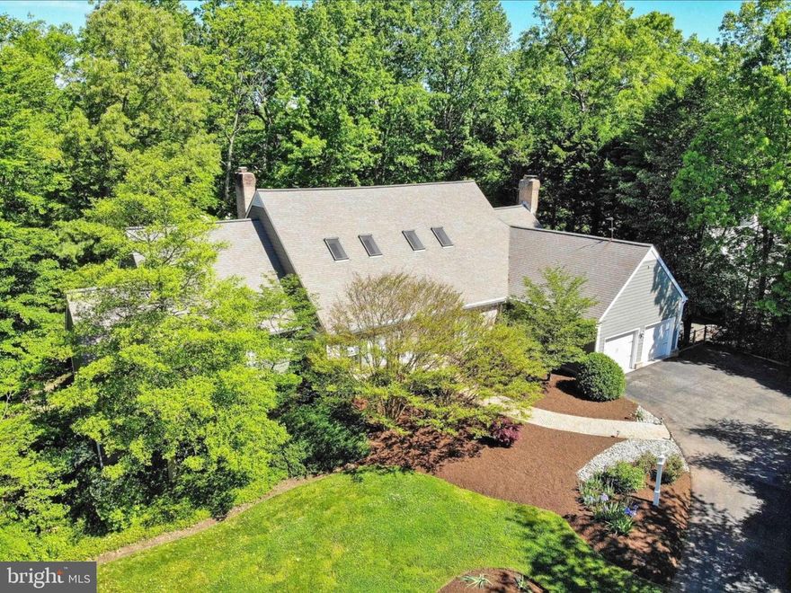 Welcome to 1620 Wyatts Ridge Rd, an exceptional custom estate located in the prestigious Belvoir Farms community of Crownsville. This Johannes-Greco home, showcases refined craftsmanship, timeless design, and elevated luxury throughout.

Set on expansive, private acreage surrounded by mature trees, the home offers a serene estate-like setting while remaining conveniently close to Annapolis and major commuter routes. Interiors are light-filled and thoughtfully designed, featuring elegant living and entertaining spaces, high-end finishes, and a seamless flow ideal for both everyday living and hosting.

The owner’s suite is a true retreat, highlighted by a spa-inspired en-suite bathroom featuring a freestanding soaking tub, dual vanities, oversized walk-in shower, and a striking accent wall that creates warmth and ambiance—an unmistakable showpiece of the home.

Belvoir Farms enhances the lifestyle with resort-style amenities including two tennis courts, a private marina with boat slips, scenic hiking trails, and a new clubhouse located across from the community with golf course scheduled for completion in 2026/2027.

1620 Wyatts Ridge Rd offers a rare opportunity to own a luxury custom home where elegant design, privacy, and exceptional community amenities come together in one of Crownsville’s most coveted neighborhoods.