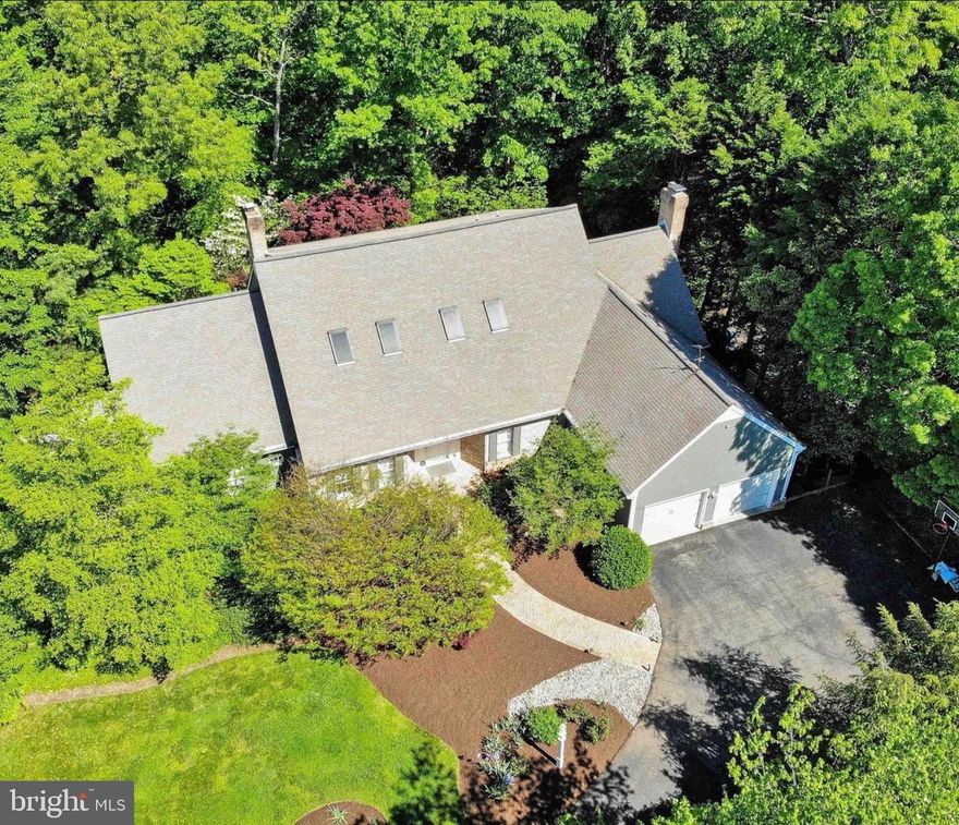 Welcome to 1620 Wyatts Ridge Rd, an exceptional custom estate located in the prestigious Belvoir Farms community of Crownsville. This Johannes-Greco home, showcases refined craftsmanship, timeless design, and elevated luxury throughout.

Set on expansive, private acreage surrounded by mature trees, the home offers a serene estate-like setting while remaining conveniently close to Annapolis and major commuter routes. Interiors are light-filled and thoughtfully designed, featuring elegant living and entertaining spaces, high-end finishes, and a seamless flow ideal for both everyday living and hosting.

The owner’s suite is a true retreat, highlighted by a spa-inspired en-suite bathroom featuring a freestanding soaking tub, dual vanities, oversized walk-in shower, and a striking accent wall that creates warmth and ambiance—an unmistakable showpiece of the home.

Belvoir Farms enhances the lifestyle with resort-style amenities including two tennis courts, a private marina with boat slips, scenic hiking trails, and a new clubhouse located across from the community with golf course scheduled for completion in 2026/2027.

1620 Wyatts Ridge Rd offers a rare opportunity to own a luxury custom home where elegant design, privacy, and exceptional community amenities come together in one of Crownsville’s most coveted neighborhoods.