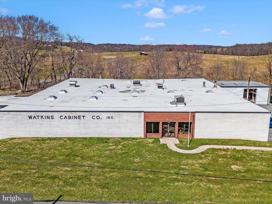 Watkins Cabinet Company Warehouse for Sale – This sale includes the Fee Simple Interest of the 14,884 sq. ft. one-level industrial/manufacturing building, situated on 62,291 sq. ft. (1.43 acres) of land, zoned IM-2.5 H-50 and Ag Reserve. The sale also includes the adjoining unimproved 22,093 sq. ft. (.51 acres) parcel (Parcel Number: P097) with similar zoning. All showings must be accompanied by the local listing agent. All prospective purchasers must provide a proof of funds letter to the listing agent prior to scheduling a showing. This sale represents a once-in-a-lifetime opportunity; interested parties should act accordingly.