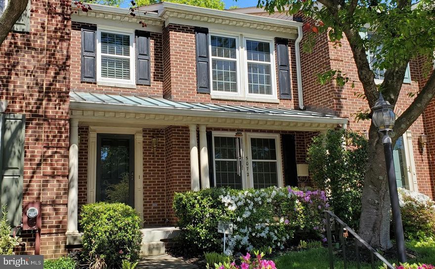 Welcome home to this all-brick townhouse backing to open space. This highly sought after, move-in ready townhouse in Harper's Choice features 3 bedrooms, 2 full & 2 half bathrooms, hardwood floors throughout the main level, an updated eat-in kitchen with granite counters, newer appliances and ceramic tile, a separate dining room, a large living room with a brick fireplace, new carpet upstairs, fresh paint, newer HVAC system, a large primary bedroom with vaulted ceilings, an en suite full bathroom with a separate tub & shower and loads of natural light from the skylight, spacious secondary rooms, a fully finished basement with an over-sized recreation room and laundry/storage/utility room, and so much more! The exterior boasts a covered front porch and a fully fenced backyard that encloses the extensive patio that has direct access to the open community space. Located conveniently near everything Columbia has to offer, this home is sure to impress and won't last long!