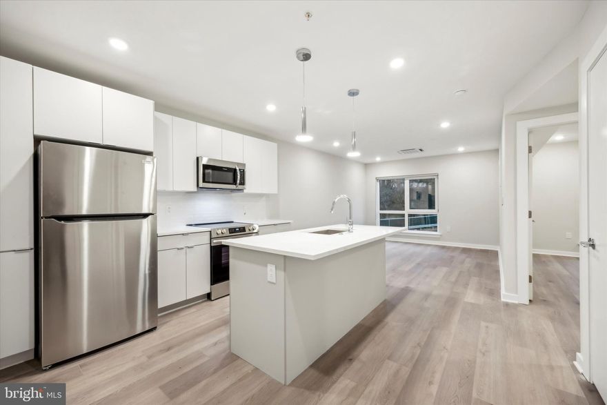 Introducing The Peak at 3449 Scotts Lane, East Falls’ newest luxury apartment community where modern living meets timeless comfort. Nestled in the heart of East Falls, The Peak offers an exceptional blend of tranquility and urban convenience, creating a lifestyle that feels both elevated and effortless.

This brand-new construction features spacious one- and two-bedroom residences designed with contemporary elegance in mind. Each apartment showcases high-end finishes, including stainless steel appliances, quartz countertops, and hardwood floors throughout. Central air conditioning ensures year-round comfort, while full-sized in-unit washers and dryers add everyday convenience. Select units also offer private outdoor spaces, perfect for unwinding or entertaining.

Residents will enjoy the peace of mind that comes with a secure, keyless Latch entry system and a dedicated package room with Parcel Pending services. The community is pet-friendly, welcoming your four-legged companions with open arms. Covered parking is available for an additional fee, and residents can take advantage of beautifully furnished communal spaces, including a rooftop deck designed for relaxation and connection.

The Peak’s prime location offers unmatched accessibility. Situated just minutes from Roxborough Memorial Hospital, Saint Joseph’s University, and the scenic Schuylkill River Trail, residents are perfectly positioned to enjoy the best of Philadelphia living. Main Street Manayunk’s vibrant shops, restaurants, and nightlife are only a short drive away. With easy access to Route 1, Interstate 76, and Kelly Drive, as well as convenient public transportation options, the entire city is truly at your doorstep.

Every detail at The Peak has been carefully considered to deliver both comfort and sophistication. From secure entrances to thoughtfully designed living spaces, this is where convenience, style, and community come together. Welcome to The Peak—East Falls’ new standard for luxury apartment living.