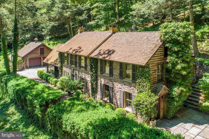 Available for the first time in almost half of a century. Step back in time and experience the charm of this historic stone farmhouse set along the Pannacussing Creek on one of Bucks County's most picturesque roads. Dating back to the early 1800's this special property which is located in charming, historic Carversville, Solebury Township exudes character and offers a unique glimpse into the past.  From the moment you arrive, you will be captivated by the timeless allure of the property's outdoor setting. There are beautiful stone walls, a cobble-stoned drive and courtyard, pebbled walkways, custom iron gates and three separate terraces spread throughout the property, each on a different level thus providing a variety of perfect spots for enjoying the tranquility and privacy of the 8 + acres of nature and listening to the sound of the running creek.  This property is available turnkey. 
Stepping inside the home, one will appreciate the many details that surround this lovingly preserved farmhouse. From the beamed ceilings, exposed stone walls, hardwood floors, built-in cabinets, 3 fireplaces, and cozy nooks and crannies to the numerous charming details all reflecting the era in which the home was built. There is a warmth, character and sense of history that makes this property a unique and timeless living space. Make this historic stone farmhouse your own. Embrace the past while creating memories that will last a lifetime in this truly special home. Less than a mile from the Delaware River and its towpath, the home is perfectly situated near many shopping and dining venues, numerous farm markets and orchards, antique and art galleries, the river towns of New Hope and Lambertville plus many other charming villages like Lumberville, Stockton and Frenchtown on both the PA and NJ sides of the river. This home is just 75 minutes to New York City or 60 minutes to Philadelphia.