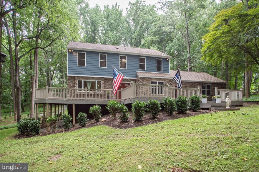 Virtual Walk-Through Available in the Virtual Tours Tab or by Visiting Joshua Watson Real Estate on YouTube.

Welcome to your own private oasis! Sitting on 2.68 acres, 15 Barnstable Court is an absolute dream home consisting of 5 bedrooms, 3.5 bathrooms, a wraparound deck, fenced in yard, new luxury vinyl flooring, updated bathrooms, and much more! This home features an oversized driveway and a separate gravel parking area that is perfect for an RV or additional car parking. There are two entrances to the front of the home. The first door will lead you to the large mud room which boasts built in cubbies. The second door will be the homes primary front door. Walking through this door, you will be greeted by new luxury vinyl flooring which is featured throughout the first and second floor. The first floor shows a sitting room, dining room, kitchen, main living room, wood burning fireplace, mudroom, a bedroom, a full bathroom, and access to the 2-car garage. Each room flows seamlessly into each other with the dining room and kitchen both providing access to the deck. The kitchen is beautifully laid out with shaker cabinets, granite countertops, chic backsplash, stainless steel appliances, dual ovens, and provides that open concept feel with the living room. The second floor presents 4 large bedrooms, two full bathrooms, and a washer/dryer. The primary bedroom sits at the end of this floor and reveals a stunning primary bathroom which is made complete with a gorgeous dual vanity and custom tile work! Heading down to the basement you will observe an office, living room, game room area, half bathroom, and a walk out to the backyard. Last but certainly not least, the home boasts a wraparound deck! This composite deck is big enough to host the largest of family gatherings and even has its own screened in lounge. The lounge overlooks the newly sodded fenced in yard and provides a spectacular view of the mature trees that line the property. Truly your own private oasis! Some of the most notable renovations/features include a home generator, 12x18 shed (2018), full basement remodel (2019), new luxury vinyl flooring (2022), 2 full bathroom remodels (2022), new sod/landscaping (2021/2022), and a new backyard fence (2021). This home will not last long! Schedule your showing today!