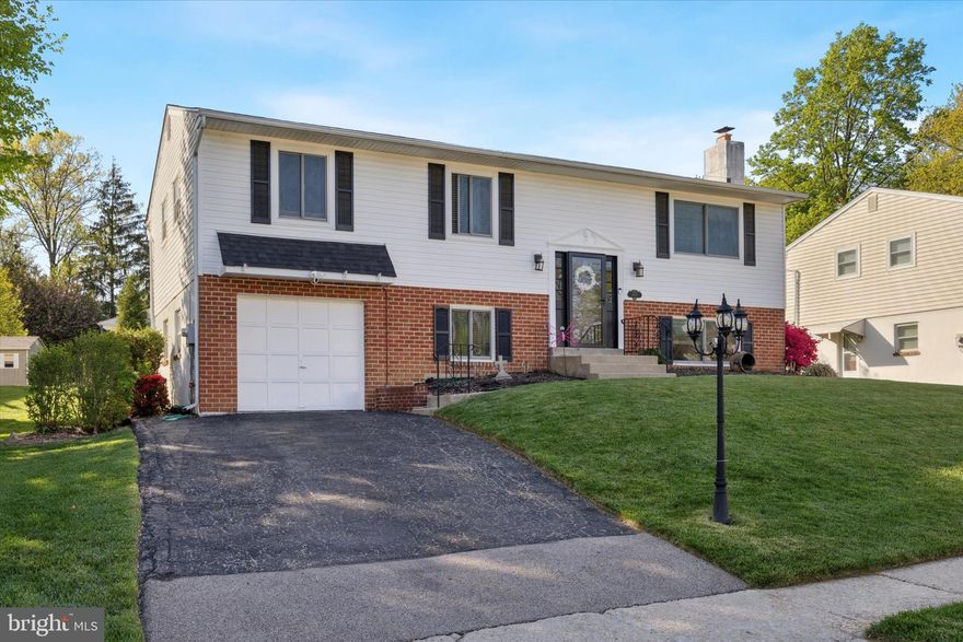 Talk about the Location of this charming 4 Bedroom, 2.5 bath bi-level single family home on a Cul-de-Sac in Colonial School District! Tucked away on a quiet street, this beautifully maintained home is in walking distance to Miles Park, shops Whitemarsh Elementary, Library and so much more!  The open-concept living and dining area flows seamlessly into the roomy kitchen, complete with big windows for a view of the large backyard—perfect for relaxing or entertaining. The upper level also includes a spacious primary suite with an en suite bath, two additional spacious bedrooms with ceiling fans, a full hall ceramic tile bath and plenty of closet space. Bonus  There are hardwood floors under all carpets in bedrooms! The lower level features a huge family room with a wood-burning fireplace with brick surround and sliding doors that open to a generous concrete patio and yard. On the lower level you’ll also find a fourth bedroom with built-in shelving, an updated powder room, laundry room and access to the one-car garage. Recent upgrades include a newer Roof, newer hot water heater and updated electrical.  Be sure to check this one out!