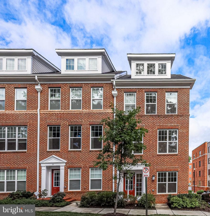 Practically new, luxury townhome in Trenton Square at Ballston located in North Arlington! Near Perfect 10 - can't beat the convenience.  Minutes from ample shopping and restaurants in Ballston Quarter. Quick commuter access: Rt. 50 (which hits all the bridges into DC), I-66, I-395, Metro and Reagan Washington National Airport. Close to military bases like Joint Base Myer Henderson Hall and National Guard Readiness Center. This trendy four-level townhome built in 2021 is move-in ready. Open concept main level is perfect for entertaining, with tall ceilings and an abundance of natural light that is only afforded in an end unit. Gourmet kitchen boasts stainless steel appliances, quartz countertops, eat-in dining and coffee bar space, and a giant center island. From the kitchen, walk out to the deck for easy grilling and relaxing. Separate dining room space leads into the living room with wall to wall windows and a stacked stone gas, crystal fireplace. Upstairs, find the primary bath with a walk-in closet and a stunning bath featuring an oversized glass shower and double sinks with quartz countertops. The second bedroom has its own full bath attached. Laundry on bedroom level. The loft level is the perfect hangout space. The rec room comes complete with a built-in bar with wine fridge and walks right out to the rooftop terrace. Loft level also features another bedroom with a full bath and plenty of closet space. Entry-level has access to the 2 car garage, a half bath, mudroom space with closet and hooks, and a study or bedroom. Visitor parking spot available in addition to garage. *Be sure to click on the link for the 3D Tour*