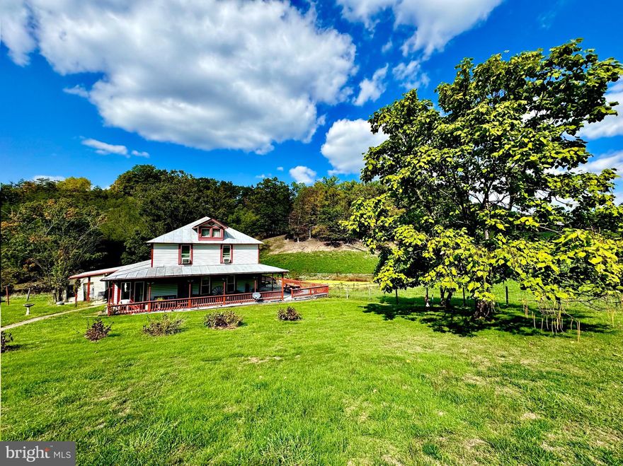 "Rustic Farmhouse Outside Petersburg" 5 +/- ACRE farm just a few miles outside Petersburg, WV. This 2,000 +/- sqft farmhouse features three bedrooms, 2 full bathrooms, multiple gathering rooms, dining room, and numerous office spaces. Paved County Road access leads to the home with panoramic views of West Virginia Mountains as you pull in the circle driveway. Enjoy sunrises and sunsets from the wrap - around porch or head inside to tongue & groove knotty pine walls and fresh laminate floors. Multiple outbuildings, fenced in pasture for horses, pond, city water, and breathtaking views. Recreational opportunities all around including some of the best trout fishing water the state has to offer, kayaking, canoeing, hiking, hunting, and much more. 1 +/- mile to Spring Run & Spring Run Trout Hatchery. 50 +/- miles to Canaan Valley & Timberline Resort. 50 +/- miles to Harrisonburg, VA & Interstate 81. 65 +/- miles to Deep Creek Lake, MD. 115 miles to Charlottesville, VA. Additional Land Available!