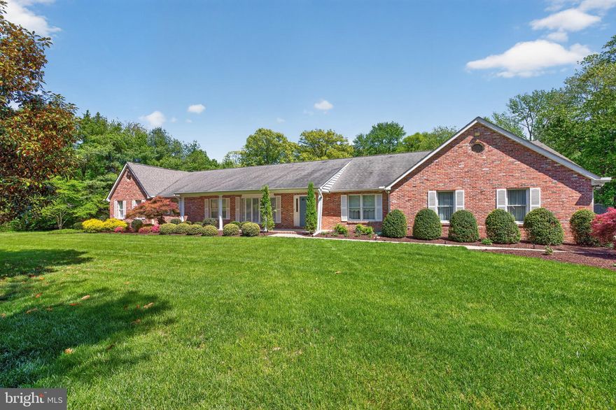 Set on a private and beautifully landscaped 2.23-acre lot, this expansive ranch-style home offers the perfect blend of comfort, functionality, and timeless charm. A stately brick front and side exterior, mature trees, and a welcoming covered front porch create an inviting first impression, while thoughtful upgrades throughout make everyday living effortless.
Inside, you’ll find spacious, light-filled living areas enhanced by hardwood floors, Andersen windows, recessed lighting, and solid wood doors. The well-appointed kitchen features granite countertops, ceramic tile flooring, and a bright breakfast area—ideal for casual dining. Elegant French doors connect the living and family rooms, while a large bay window in the living room and built-in bookshelves add warmth and character to the family room, complete with a brick raised-hearth wood-burning fireplace.
The primary suite is a true retreat, featuring a vaulted ceiling, cozy loft with built-in bookshelves, a sitting area, and dual cedar walk-in closets. The en-suite bath offers a spa-like experience with a dual-sink vanity, soaking tub, and separate tiled shower. Additional bedrooms are generously sized, including one with its own walk-in closet, and the hall bath is thoughtfully designed with separate vanity and bathing areas.
Step outside to enjoy the home’s exceptional outdoor amenities. A large 14' x 36' newly covered rear deck provides the perfect space for relaxing or entertaining, overlooking a heated in-ground 20' x 40' pool with surrounding fencing for added privacy. The property also includes a fenced area for chickens, garden area, shed with a new roof, and underground lawn irrigation to keep the grounds lush and green.
Additional highlights include a side-entry two-car garage with two new openers, a whole-house generator, central vacuum system, four-zone HVAC with gas heat, two gas water heaters, and a full, unfinished walkout basement with a brick raised-hearth wood burning fireplace, offering endless potential.
This well-maintained home combines space, privacy, and versatility—an exceptional opportunity for those seeking peaceful living with modern conveniences.