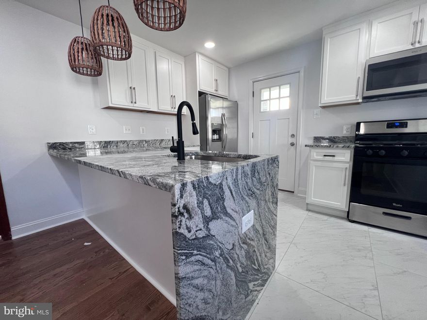 Welcome to this charming, completely renovated and well-maintained 2-bedroom, 1-bath detached Ranch/Rambler nestled in the sought-after Queens Chapel area of Hyattsville—just 4 minutes from the DC line. This thoughtfully updated home blends timeless character with modern style, showcasing original woodwork alongside contemporary upgrades for a warm yet refreshed feel. Natural light fills the home, enhancing the recessed lighting and highlighting the updated stainless steel appliances, while the surprisingly spacious bedrooms offer comfort and flexibility.<br /><br />

This home is equipped with a tankless water heater for added efficiency and offers excellent storage with two sheds located in the backyard. Enjoy a spacious front and backyard—perfect for entertaining, gardening, or simply relaxing outdoors—and a cozy front porch that’s ideal for morning coffee or unwinding in the evening.<br /><br />


Ideally located just minutes from the West Hyattsville Metro Station, along with multiple Metrobus routes on Queens Chapel Rd and Riggs Rd, commuting into Washington, DC and surrounding areas is a breeze. Enjoy the convenience of nearby shopping and dining, including The Mall at Prince George’s, Giant Food, Aldi, and Safeway, as well as a variety of local restaurants and shops along East-West Highway and Queens Chapel Road. With on-street parking and a manageable layout, this home offers the perfect blend of charm, modern updates, and prime location—ready to welcome its next owner.