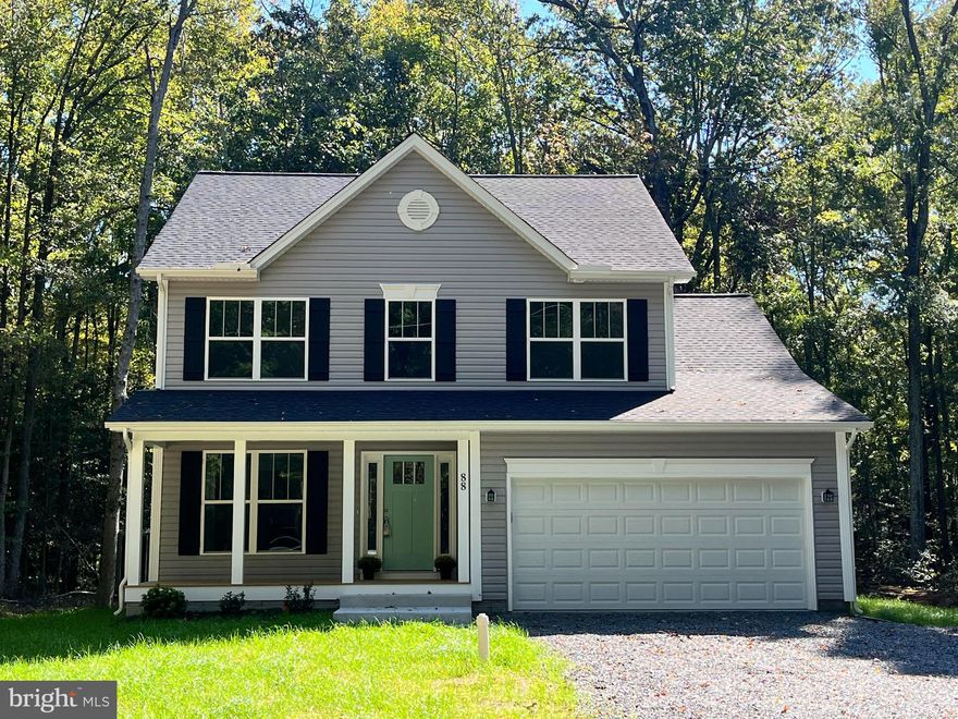 FULLY FINISHED AND READY FOR QUICK MOVE IN! Hamlet Homes has just finished construction and has put in a flourishing yard and is now time to pass along to the next lucky buyers to call this home! This Monroe Model boasts 4 bedrooms, 2.5 Baths, SCREENED in deck, AND spacious front porch, a large (.25/acre) cleared yard, PRIVATE location sitting amongst the trees (so serene and beautiful with lots of wildlife), the kitchen alone has lots of 42" tall cabinets, a full stainless steel appliance package, Large Island with granite overhang for stools, and LVP plank flooring! The 2 car garage comes with opener and keyless pad entry. The bathrooms include adult height vanity's and UPGRADED vanity tops, Tile soaker tub, and tile showers and LVP Plank flooring!! Ceiling Fans and lighting in every room, all LED lighting. Located in the water percs & golf cart friendly Subd, Placid Bay Estates which is a voluntary HOA (meaning to use the amenity's you can join for only $200/year!!!)  which enjoy either Lake Placid OR the Potomac with entry's to both waterways. Also there is a club house, boat dock and fishing pier. Also just 5 minutes down the road from the Town of Colonial Beach where you can find your favorite restaurants, diners, bars, with tons of events every weekend including music on the green, car shows, food trucks, motorcycle shows, farmers markets, antique fairs, and much much more. Come check out why more and more people are choosing the Colonial Beach way of beach life with lower taxes, small home town community and short commutes to Dahlgren, Maryland & Fredericksburg!