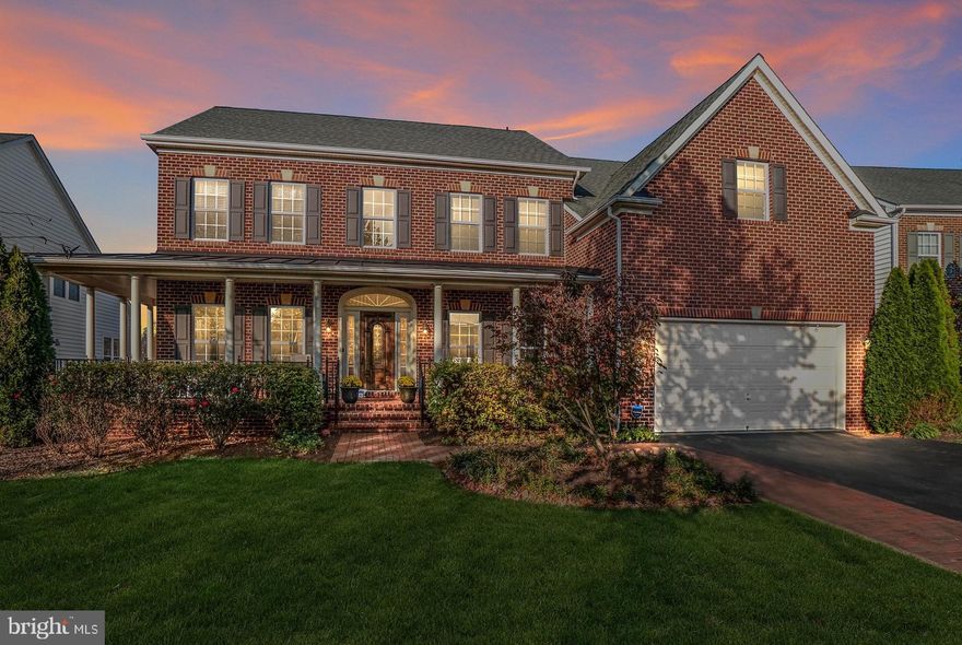 Over 6000 sq. ft of elegant living space offering comfort and luxury throughout. This well-designed NV Remington Place II with the optional 4th level is a very rare find! 6 Bedrooms, 5.5 Baths, 2 story family room, dual stairs, formal living and dining rooms, hardwood floors, crown moulding, office/den, gourmet granite kitchen with center island, tiled backsplash and walk-in pantry, morning room addition, luxury owner's suite with optional sitting room, private balcony and upgraded master bath, fully finished walkout basement with custom wet bar, rec room, additional bedroom/home office, 2 gas fireplaces, large custom Apex deck, gorgeous patio with outdoor fireplaces, outdoor lighting, wrap-around front porch and so much more. This home truly has it all and has been wonderfully maintained by its owners. Spectacular lot backing to beautiful trees and conservation area. Located in coveted newer section of Villages of Urbana. Excellent community amenities. Close to shopping, restaurants and major commuter routes. BLUE RIBBON Schools!