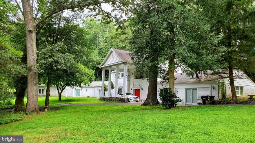 Spacious Great Falls home  with 4424 sq ft above ground on a 2acre lot in a coveted school pyramid.  Expect commuting convenience with only a few minutes drive to  major commuting routes providing quick access to shopping, restaurants, offices, major employers and business sites, and health care facilities. 

This 2 level home, built in 1956 (top level), 1968 (lower level right side) with a large addition in 2001 (left side), offers 4+ bedrooms, 4 full baths, 3 heat pumps, 3 fireplaces (2 propane & 1 wood-burning), 2 kitchens, 2 electric services (the addition gets its own bill).  Large rooms and open floor plan with majority of space on main level (think of as an incredibly spacious rambler +  additional private space for independent living on upper level)  Home  includes a bonus main level  living space that was previously a  garage (easily converted back at modest cost).

Stunning 2 acre lot with a circular driveway includes 2 accesses off Springvale Rd with at least 15+sparking spaces and ample room for adding a pool and/or possible tennis court.  Most of the adjacent homes beyond this corner lot have  already connected to public water. Fairfax Water has confirmed that  public water hookup would be available if desired.

This well-loved home provides enticing opportunities for you to update into your own showplace.  The rare expanse of almost step-free space on the main level could have special appeal for a wide array of occupants, including those seeking suitable accessible space for in-law suite/s.  You might also want to check out the strong potential for satisfying Fairfax County requirements for allowing a rentable accessory dwelling unit (ADL) which could provide reliable extra  income for the owner.  For further information regarding requirements please check the Fairfax County website which includes a description of ADL requirements,  FAQ pages, and ADL application information.
 
INVESTOR ALERT!  Visualize the array of additional rental and potential residential-based business opportunities  this unique, centrally located property presents.