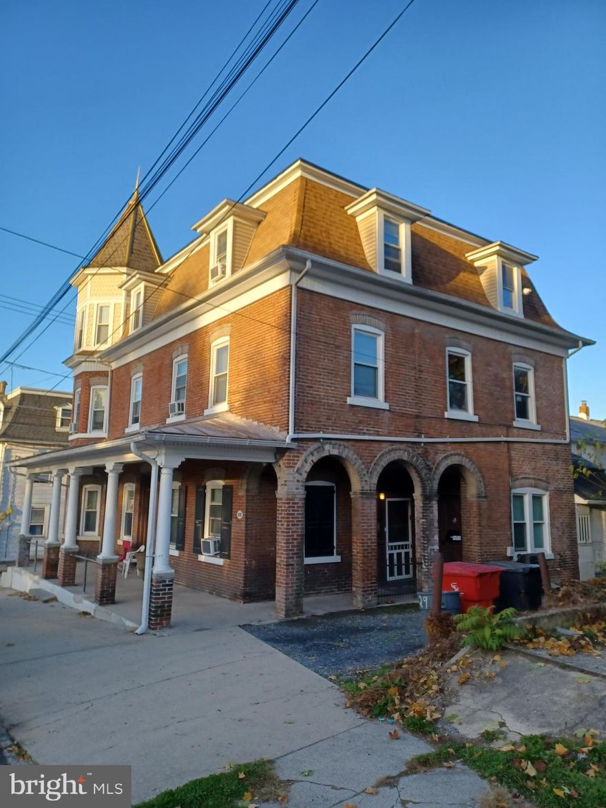 Beautiful buillding built in 1900 as a tavern and a hotel, currently serving as a rooming house consisting of 12 rooms, 4 bathrooms, 3 kitchenettes.  There is a 2 room storage area with a half bathroom, which if desired, might be converted to additional rental.  Large basement.  Gross income is $90,480, net income is $68,691.  Cap rate is 9.20%. 

Upgrades include new windows, new kitchenetts, roof replaced in 2016 on part of the building, and 2024 roof on other part of the building, newish paint and floors throughout the building.  Building is well maintained.  Localed in desirable area, close to bus stops, shopping centers, it has all long term tenants carefully selected from multiple applications.

Also for sale under: MLS # PANH2007558 (commerical listing)