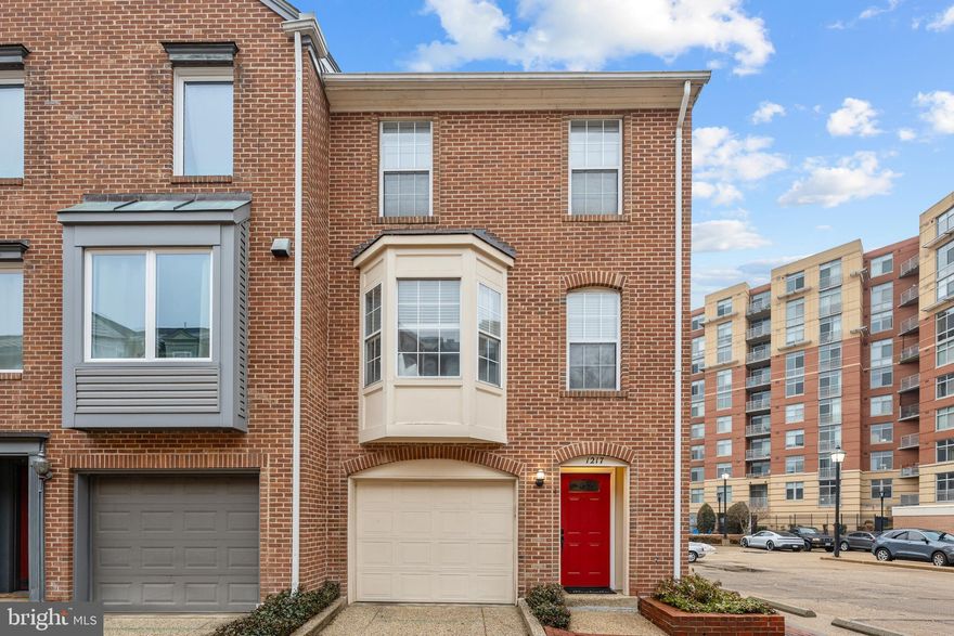 Welcome home to Braddock Place! This classic brick townhome with garage enjoys the abundant natural light that only an end unit can offer, ideally situated to offer the perfect balance of privacy and convenience and an easy commute. Inside, an abundance of modern updates complements the home's classic charm, with refinished hardwood floors, sophisticated crown molding, and dual-mode recessed lighting all set a polished tone throughout the house. The open-concept main level, where the living and dining areas flow effortlessly together are ideal for everyday living and entertaining alike. The gorgeous updated kitchen (2023) boasts plenty of bright Shaker-style cabinetry, stainless steel appliances, sleek quartz countertops, and an added pantry featuring pull out drawers and lots of storage. A peninsula breakfast bar with stylish pendant lighting connects seamlessly to the dining space. Upstairs, both generously sized carpeted bedrooms offer wall-to-wall closets featuring built-in organizational systems and their own private updated en suite bathrooms. On the lower level, a versatile family room opens directly to the backyard patio - a peaceful retreat perfect for grilling, dining al fresco, and entertaining, surrounded by a newer fence (2024) for privacy. One-car garage with interior access and shelving for additional storage rounds out the home, with off-street guest parking available nearby. Additional highlights include a new front door and exterior lighting, an enlarged electrical panel, tankless water heater (2023), HVAC (2022), and attic storage accessible via drop-down stairs as well as a closet with plentiful storage under the stairs on the main level. This is a pedestrian-friendly, bikeable area, just under 3/4 of a mile to the shops, dining, and energy of King Street, and just minutes to Harris Teeter, Trader Joe's, the Fashion Center at Pentagon City, Potomac Yard, Del Ray, Oronoco Bay Park, Charles Houston Recreation Center and Pool, and the lively Old Town Alexandria waterfront. Only 0.1 miles to Braddock Road Metro station, with free DASH bus service and quick access to Route 1, I-495, and the GW Parkway. Only minutes away from National Airport and Washington DC, this can be your private oasis near the action but away from the hubbub. Schedule a private tour of your gorgeous new home today!