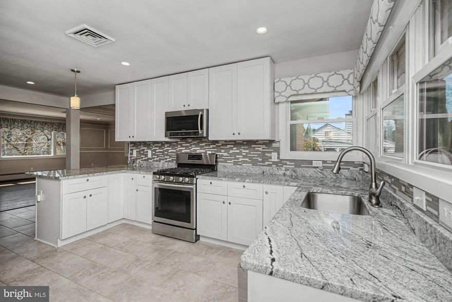 OPEN HOUSE, Wednesday, March 25th from 12 pm to 2 pm!   Rare opportunity to own in highly sought-after West Towson—one of Baltimore County’s most desirable neighborhoods! This beautifully renovated 4-bedroom, 3-bath rancher offers nearly 3,200 square feet of finished living space, including a fully finished basement and a 2-car garage.

The heart of the home is the stunning open-concept layout, seamlessly connecting the gourmet kitchen, living room, and spacious dining area—perfect for both everyday living and entertaining. The luxury kitchen features stainless steel appliances, granite countertops, and exceptional flow that makes gathering effortless.

The main level is highlighted by gleaming hardwood floors, a convenient first-floor laundry, and an unbelievable primary suite. Retreat to your private oasis complete with a massive walk-in closet and stylish barn doors leading to a beautifully updated en suite bath with double vanity and an impressive stand-up shower.

The fully finished basement adds even more versatile living space—ideal for a media room, home office, or guest accommodations.

Additional upgrades include new Pella windows, gas fireplace, central air, and a brand-new HVAC system. Outside, enjoy copper gutters, tiered landscaping, and a rear patio designed for relaxing or entertaining.

This property also includes an additional parcel of land and a driveway that accommodates four vehicles, in addition to the garage. Ideally located on the quieter end of Chesapeake Avenue, just minutes from the Towson YMCA, shopping, dining, and top-rated Baltimore County schools.