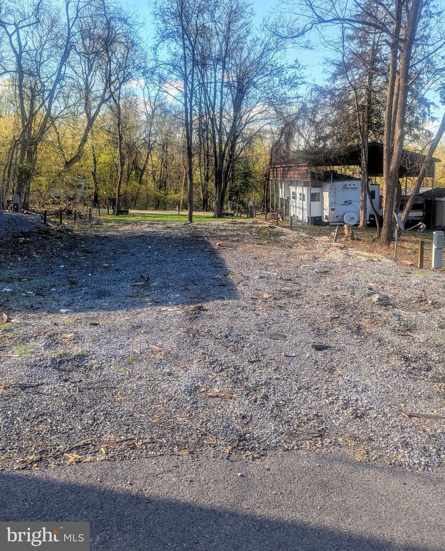 This is a gated community, so you need to enter at the guard shack. Entry is not permitted without ID per the office rules. Bring IDs to the office or guard shack for visitor pass. THIS IS A SEASONAL CAMPGROUND! OPEN FROM APRIL 1 TO NOVEMBER 1.  Large empty lot to bring your camper and make your own to enjoy time with your family & friends. River Bend is a privately owned 400 acre recreational- vehicle camp resort with seasonal activities for members, families and guests. Less than a 2-hour drive from the Washington and Baltimore metro area. Open with utilities from April 1 to November 1. Lot owners have access to their property the entire year. *** Members Enjoy *** * Amazing views and wildlife, Potomac River access, Trails, Swimming pools, Mini-Golf, Youth center, Tennis and basketball courts, laundry facilities, convenience store, deli and lounge. *Bath houses throughout the park, boat ramp, bar and grill and even a church located on the grounds. River Bend also hosts numerous activities such as 4th of July fireworks, small carnival, bonfires, poker runs, horseshoe tournaments, car show, Halloween Trick or Treat and so much more. The river is deep water for swimming, tubing and water skiing. CAN NOT LIVE HERE YEAR ROUND