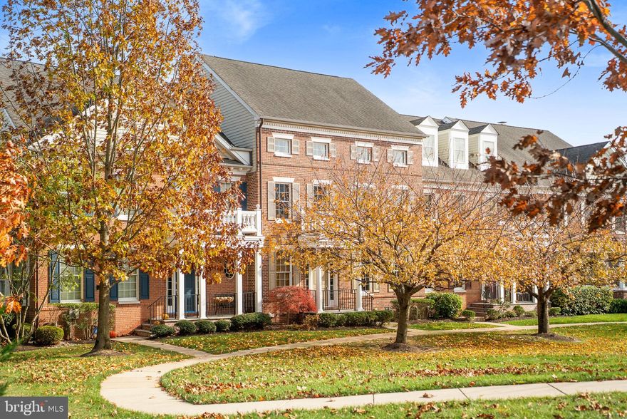 This Newtown Walk luxury townhome offers modern amenities and fantastic space within a quiet courtyard setting, just outside a historic borough. Situated within walking distance to boutique shops, top-rated dining, and entertainment in Bucks County’s acclaimed Newtown Borough, this 4-bedroom residence features Federalist-style architecture with brick and Hardie Plank exteriors thoughtfully designed to complement the surroundings. A walkway bordered by beautiful cherry trees leads to picturesque courtyard views that support a private, low-maintenance lifestyle. The interior comprises three levels of well-appointed living space. The main floor presents an open-concept layout, generously sized rooms, nine-foot ceilings, hardwood floors, stunning moldings, and access to a private deck with privacy screen and garden. The adjacent family room includes a gas fireplace and built-in shelving, enhancing both comfort and entertainment potential. The kitchen is equipped with cherry cabinetry, granite countertops, spacious multi-tier island, stainless steel appliances, double sink, and breakfast nook. Additional features on this level include a half bath and a convenient laundry/mud room. The upper-level primary suite is a wonderful retreat with glistening hardwood floors, two generous walk-in closets and a newly renovated spa-inspired bath featuring dual marble vanities, radiant heat flooring, heated towel rack, water closet, and beautiful walk-in shower. Two additional bedrooms share a full hall bath and feature gleaming hardwood flooring and sun kissed space. The third level offers wonderful flexibility with a living area, bedroom, and full bath, suitable for guests, a home office, or space to play. The lower level allows for customization, with the ability to add further living space, sleeping space and a full bathroom if desired. Additional amenities include a two-car garage, new air conditioning, Trek deck, newer two-zone heating and cooling system, fresh paint, and ample storage. The homeowners’ association helps navigate a low maintenance lifestyle and covers common area maintenance, exterior upkeep, trash collection, and snow removal. Located on a premium lot adjacent to Roberts Ridge park within the award-winning Council Rock School District, this property offers convenient access to trains, the I-295 corridor for easy travel to Philadelphia, Princeton and New York and the suitability and charm that Newtown has to offer.