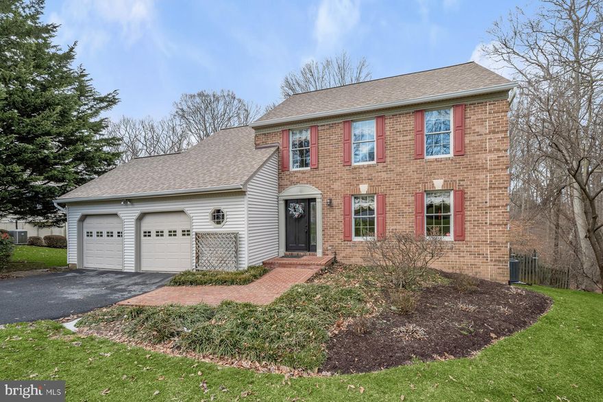 Nestled within a peaceful neighborhood, this inviting 5-bedroom, 3.5-bath home offers a blend of comfort and sophistication. The updated kitchen sparkles beside a family room that shines with vaulted ceilings, skylights, and a warm brick fireplace. Entertain in style with the separate dining room, ready to host your most memorable dinners. The primary bedroom sanctuary features an ample walk-in closet and an en-suite bathroom for a touch of luxury. For those who work from home, enjoy the versatility of an upper-level office that doubles as an extra bedroom, complete with a walk-in closet and a serene view of the vibrant family room activities below. Two more bedrooms complement the upper level's accommodations. Indulge in ultimate leisure in the fully finished basement, equipped with a full bath, additional bedroom, and a walkout that leads you into the embrace of nature. Revel in the backyard's tranquility from your deck, bordered by woods and a whispering creek. With a 2-car garage included, your new home melds serene living with modern convenience. Located in a nationally recognized school district, this home offers a solid foundation for comfortable living and learning.