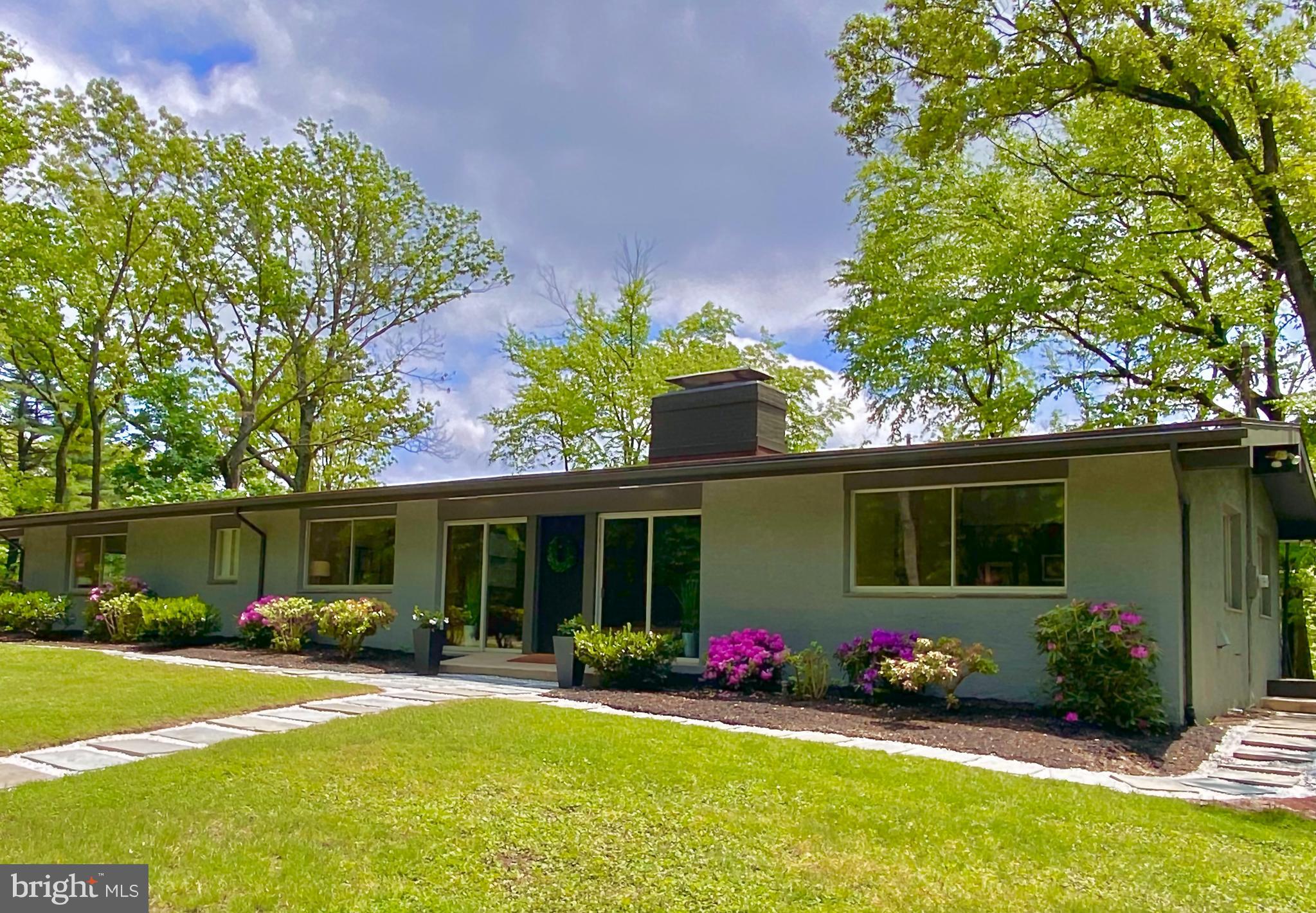 A rare find in Chester County, this custom Contemporary home is situated in an extremely private and quiet setting with expansive land and scenic views. Updated with a careful eye to architectural details and design features this home offers modern living at its finest! Welcome to 1555 Horseshoe Trail in Malvern. Located at the top of Valley Forge Mountain at one of the highest elevations in Tredyffrin Township, this home offers 3,576 sq. ft. of open and spacious mid-century modern living, 3.1 acres of land with 360-degree views, and includes your very own paddle ball/tennis court.
A bright & light Foyer entry flanked by glass sliding doors, welcomes you to the open concept Living/Dining area with gorgeous wood paneling, beautiful hardwood flooring and a floor-to-ceiling wood burning fireplace with raised hearth and a unique built-in side planter with up-lighting. The Living/Dining Area also features glass sliders that open to a ¾ wraparound deck offering spectacular views from everywhere in the house and providing you with access to the outdoors at any given time. The vaulted ceilings of the main Living/Dining Area and Kitchen join the rooms creating a special ambiance for everyday living and entertaining. The modern Kitchen offers clean lines where the flat front cabinets offset the white counters. The butcher block center island with marble insert is the perfect place to prepare food or serve a quick meal. There is also a half wall with a server window opening to the Dining Room. On the opposite end of the house is the Primary Bedroom & Bath along with 3 additional main floor Bedrooms and 2 completely renovated Bathrooms. All the Bedrooms have freshly painted walls, gorgeous hardwood flooring, excellent closet space and sliders to the wrap-around deck. A custom Home Office space with wide windows is adjacent to the Primary Bedroom and the bonus cedar closet completes this level.
On the lower level, there is an amazing Family Room with a wall of glass sliders providing tons of sunlight and beautiful views. This is an excellent space for hanging out or entertaining family & friends with a wet bar at one end - complete with a retro bar and stools, a brick wood-burning fireplace in the center and stunning custom-built bookcases with recessed lighting at the opposite end. There is also a renovated Powder Room, Exercise Room, Garden/Work Room, and a Mud Room with laundry hook up, a door to the Patio and inside access to the attached 2 Car Garage. This level has a large unfinished Storage/Utility Room as well.
Heading outside you can enjoy hosting social gatherings on the large Patio and upper Deck or for more active get-togethers, invite friends over for a paddle/tennis game on your very own court…Endless possibilities for the outdoor space.
Nature enthusiasts can enjoy hiking in Valley Forge National Park, walk or bike down the street to the Valley Forge Mountain Swim Club, or get a round of golf in at the Phoenixville Country Club. Additionally, there is the neighborhood Wharton Esherick Museum. The home is also a short drive to Paoli train station, shopping and restaurants, and is located in the award-winning Tredyffrin-Easttown School District.
This listing reflects the Total Lot Size of 2 Parcels: 3.1 Acres and the Total Annual Tax (2022) of 2 Parcels : $ 14,343
2 Parcel details are as follows (information taken from the Public Records):
HOUSE/LAND PARCEL - Tax ID # 42-04-0032, Address: 1555 Horseshoe Trail, Malvern (Tredyffrin Twp), Lot Size: 1.7 Acres, Annual Taxes: $11,961 (2022), Land Asmt: $133,490, Bldg Asmt: $237,590, Taxable Total Asmt: $371,080
LOT/LAND PARCEL - Tax ID # 27-08-0037, Address: Country Club Rd, Phoenixville, (Schuylkill Twp), Lot Size: 1.4 Acres, Annual Taxes: $2,382 (2022), Land Asmt: $59,750, Taxable Total Asmt: $59,750