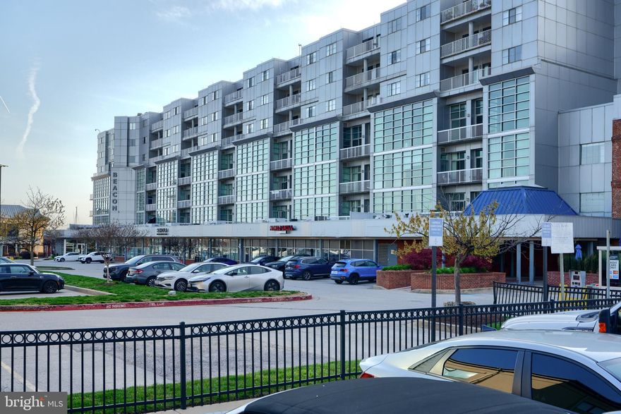 Experience resort-style living at an unbeatable price in the highly desirable Lighthouse Point condominium complex, located at Baltimore's Canton waterfront. This top-floor condominium offers serene courtyard views, combining privacy with the vibrant city life right at your doorstep. This appealing unit features two spacious bedrooms and two full bathrooms, ensuring comfort and privacy for all residents. Recent updates include a new kitchen range and HVAC unit, as well as enhancements by a professional painter, bringing a fresh and modern touch to the space. The modern, open floor plan is bathed in natural light, creating a welcoming atmosphere for both entertaining and relaxation. Located within walking distance are some of Baltimore's finest local dining, bars, grocery stores, and boutique shops. Fitness enthusiasts will appreciate the nearby athletic clubs and a swim club, with all amenities conveniently accessible just beyond the gated entry. Included with this condo is a coveted deeded garage parking spot (#219), alongside ample street parking available for guests. The building also features a fitness center and offers 24-hour security, providing both convenience and peace of mind. Priced at just $250,000, this condo is a fantastic value in one of Baltimore’s most sought-after locations by the Canton waterfront. Don’t miss out on the chance to call this ideal Canton retreat your new home.