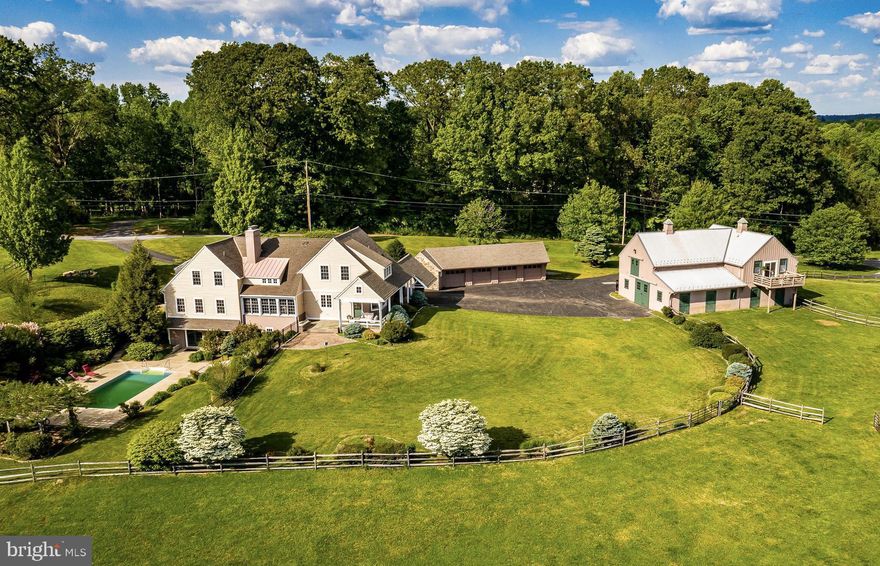 Only once in lifetime does such an incredible property like this come on the market, set in a highly desirable area, and sporting the amenities that only an Archer & Buchanan designed home can deliver. The 5,454 square foot home features an open main level floor plan centered around a large Living Room with a 16’ board and beam ceiling, a stone fireplace with a wood stove insert, and a wall of windows offering views of your pastures and woodlands. The spacious Kitchen boasts an abundance of cabinetry the chef in the family will cherish. A formal Dining Room is located off the Kitchen, as is a Mud Room and Laundry. Accessed from the Kitchen are porches and patios - perfect for informal entertaining with friends and family. On the north side of the Living Room is access to a Hallway with a convenient Powder Room and large Office with plenty of natural light and impressive built-in cherry cabinetry. In the current environment where many people are working from home, the Office’s private and quiet location is a huge benefit. We next enter the spacious Master Suite with two large Walk-in Closets, a restful Bedroom with windows overlooking the private view, and a large Bathroom. Upstairs are three bedrooms, one with an en-suite bathroom and the other two sharing a Jack-and-Jill Bathroom. Downstairs is a large Playroom, a fifth bedroom, also with a full bathroom, plenty of good storage space, and a large Family Room that accesses the swimming pool area. This home’s design is very flexible, especially if you have to care for an in-law for whom the first floor master is ideal yet leaving a second suite in the upper level for your use. Or maybe the in-laws or guests would rather have the Lower Level suite. As stated, there is great flexibility here. Further amenities include a four bay Garage with an attached workshop. The equestrian facilities of this wonderful 21.2 acre farm include a barn with 6 large box stalls, a wash stall, heated tack room, and plenty of hay and bedding storage above in the loft. There is also a lovely apartment with living room, kitchen, bedroom, and bathroom. This could be rented out or reserved for a barn helper. Additionally, your horses will love the four pastures and a large riding ring. The location of the farm for the equestrian is perfect as you are only a short hack to the 1000+ acre LenFest Preserve and in Radnor Hunt’s Brandywine country. The farm is also set in the highly-sought after Unionville-Chadds Ford School District and only 10 minutes from West Chester Boro. In short, this farm has it all - a stellar Archer & Buchanan home, great location, award-winning schools, and superior equestrian amenities and location. This farm is very well priced for today’s market so, if you have longed for a stunning farm with outstanding amenities and in a superior location, make an appointment today to see this one-of-a-kind property!