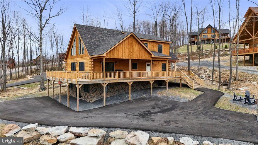 “Mystic Mountain Manor” is an income-producing vacation rental located minutes from Wisp Resort, Lodestone Golf Course, and Deep Creek Lake. This 5-bedroom, 5.5-bath stone and log chalet offers 3,283 finished square feet and sits on a beautiful ½-acre lot in one of the area’s strongest four-season rental corridors.

Designed with short-term rental performance in mind, the layout features five ensuite bedrooms, an oversized loft, and a fully finished walk-out basement with a second living area and game room with a pool table. The open-concept main level includes a two-story great room with a stacked stone gas fireplace, stainless steel appliances, granite countertops, hardwood cabinetry, and bar seating. Wrap-around deck and hot tub enhance guest appeal.

Built in 2023 with upgraded LVP flooring, granite in all baths, custom lighting, and quality finishes throughout, this property offers the benefit of newer construction with minimal deferred maintenance. Sold fully furnished and operating as an established vacation rental with an average daily rental of $343 and a projected gross annual rental income of $47k to $52k.

Membership in The Wisp Resort Master Association – Lakeside Park conveys access to a 1.94-acre waterfront parcel with 170 feet of Deep Creek Lake frontage, pavilion, lake-view seating platform, restrooms, walking trails, and parking.

Turnkey opportunity in a proven Deep Creek Lake location.