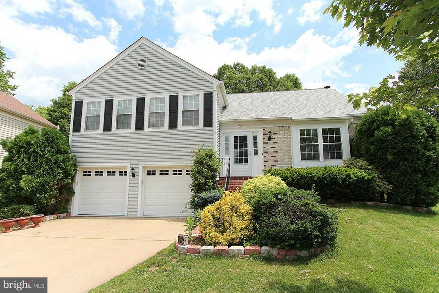 Updated 4 level Colonial in the heart of Manassas - 4 bedroom & 3 full baths - Gleaming hardwood floors - Roof 2 years old - Updated kitchen with granite counters that leads to a separate dining room - All baths recently updated - Lower level has a large family room and bedroom with full bath  - Basement has a den or exercise room - Private backyard that backs to trees and features a large deck