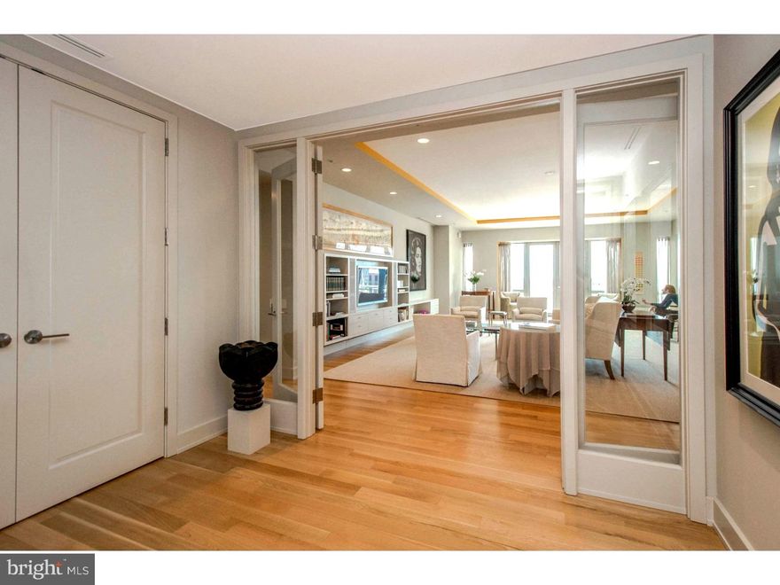 This exceptional residence greets all with a completely private entrance into an inviting foyer. Through double glass doors enter the bright Living Room featuring neutral decor, hardwood flooring, custom built-ins, tray ceiling for added dimension and double doors to a balcony. Flowing to the right is the Dining Room with hardwood flooring and temperature controlled 1000 bottle Wine Room. The spectacular, sophisticated Joanne Hudson designed Kitchen is appointed with gleaming cabinetry, Wolf oven, microwave and cooktop, Sub Zero refrigerator/freezer, Miele dishwasher, quartz countertops, center island and a large adjacent Pantry. The spacious Family Room with double doors to a large balcony is the perfect place to enjoy fun times with family and friends. The luxurious Master Suite offers a gorgeous Master Bedroom, sitting area, study, His and Her marble Baths and large custom walk-in closet. Two additional Bedrooms both have en-suite marble Baths and wonderful closets. A Powder Room and Laundry Room complete this home. Sitting on the entire 7th floor of 1706, boasting 9 ft.+ ceilings throughout, is a residence beyond compare - a masterpiece of design. Of course, you will also enjoy additional amenities including 24 hour Concierge, a "state of the art" automatic indoor parking system (2 included parking spaces) along with the fully equipped fitness center and swimming facility. With the grace and charm of Philadelphia's finest location you will be steps away from shopping, fine and casual dining, museums, theater and magnificent Rittenhouse Square. Make your own memories; come, experience and enjoy Center City living at it's best at 1706 Rittenhouse Square, #701 - Philadelphia's premier white glove address.