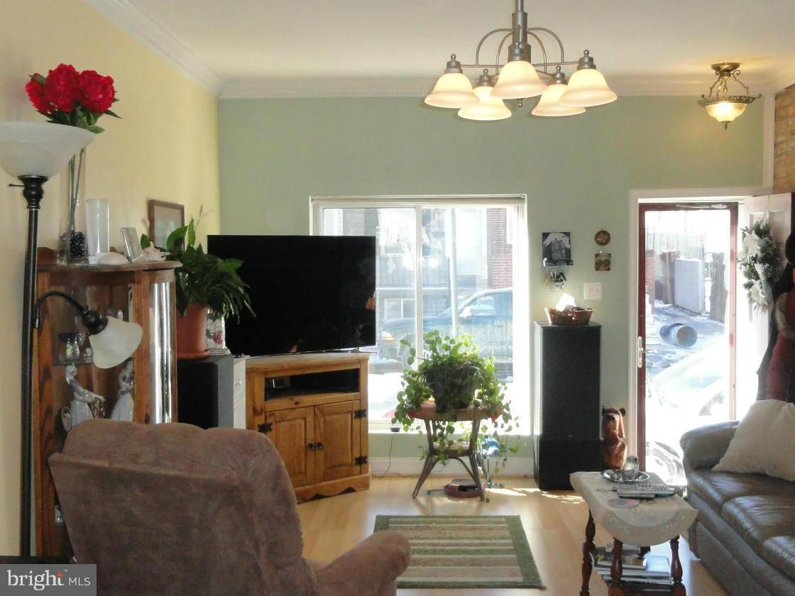 Looking for a reasonable offer for this lovely home! Renovated a few years ago- Open floor plan w/lots of natural light/Living room flows to eat-in kitchen/Rear patio also has PARKING! Oversized mstr bedroom & bath/2nd bedroom (good for room mates) Pergo & Original refinished flooring/Full basement w/laundry/New roof 2011/Home Warranty/Sump pump w/battery back-up/Steps to Canton/Patterson Park