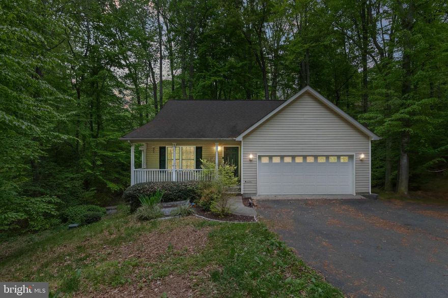 Welcome to 10668 Eisenhower Lane, located in the sought after community of Presidential Lakes. A rockin' chair front porch invites you to relax and enjoy all the sounds of nature. The vaulted ceiling Living Room includes a cozy gas fireplace. The oversized eat-in Kitchen offers a breakfast bar, stainless steel appliances, and loads of counter space! The Owner's Retreat includes a walk-in closet and full Bath with a soaker tub and separate shower. Two additional Bedrooms and a Laundry area complete the main floor. The partially finished walk-out Basement includes a huge Recreation Room with soaring ceilings, sliding glass door to the deck, an additional bonus room, and plenty of storage space too! Spend mornings on the covered side porch enjoying views of the lake. Loads of community amenities include pool, three lakes, playgrounds, covered picnic areas, basketball, open field park, community center, nature hike, and more! Welcome home!