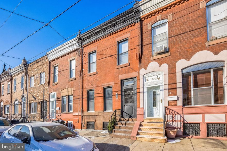 Welcome to 1928 S 16th Street, an updated 3-bedroom, 1-bath home with charming original details just steps away from Passyunk Avenue and Broad Street. Step through the vestibule and be prepared to take in the intricate fireplaces, archways, and  timeless original details throughout the home. The living room flows into the dining room, culminating in a beautifully renovated kitchen with quartz countertops, stainless steel appliances, and a large island- perfect for entertaining! Head up the stairs with the wrought iron railing to discover three inviting bedrooms, each with their own character and offering ample space for guests or a home office. The primary bedroom offers a peaceful retreat with ample closet space. The centrally located hall bathroom features delightful pink trim and sea foam green tiles with a full bathtub. The hallway also features a linen closet, perfect for easy access storage. The charm doesn't stop indoors- step outside to the spacious backyard to enjoy the fresh air and sunshine in this private outdoor space. Neighborhood staples include South Philly Taproom, Second District Brewing, Ultimo Coffee, Stina Pizzeria, Ristorante Pesto, and so much more all within a few blocks. Schedule a viewing today and discover your new home.