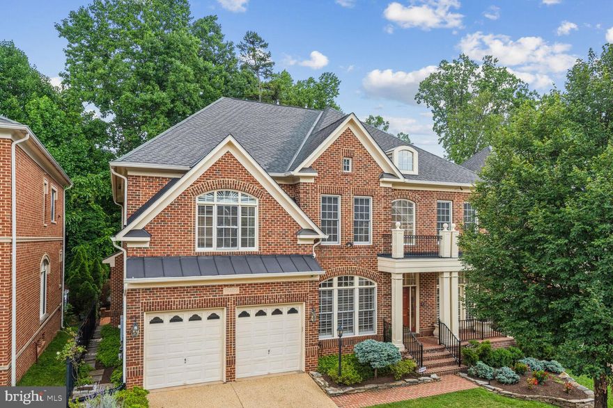 Welcome Home to 11409 Patriot Lane. This custom-built home by Churchill builders has no detail missed inside or out. Meticulously maintained and updated. 4 Bedrooms, 3.5 Baths with over 7,800 sqft. Elevator to all 3 levels. Grand 2-Story foyer with flexible and open room options for a living room, office, den, or music room. Incredible gourmet kitchen with GE Monogram stainless steel appliances, oversized center island, wine refrigerator with custom shelving, and custom-built walk-in pantry that has been expanded and remodeled with a 2nd refrigerator - making this home's kitchen a dream space to prepare, cook and entertain! The family room is off the kitchen with walls of built-in bookcases and windows and a marble fireplace. Dining room with butler's pantry. The private, relaxing primary suite is a full retreat with a sitting room and an updated luxury marble bath. Carrera marble primary bath with 2 marble vanities, oversized marble walk-in shower, soaking tub with marble surround, Hansgrohe fixtures, water closet, glass shelves, and linen closet with rough-in for a bidet. Additional special features include: a covered front porch, hardwood floors throughout, recessed lighting, custom closets, custom built-ins, plantation shutters, trey ceilings, palladian windows, dual staircases, lower-level rough-in for 2nd kitchen and an additional bath. Step out back for an absolute oasis with an incredible Chapel Valley Landscape & Serra Stone custom brick courtyard, patio with beautiful garden beds, fountain, and privacy wall all backing to trees. Expanded 2-car garage with shelving, alarm, and irrigation system. Private cul-de-sac. A few steps away from shops and restaurants at the updated and improved Cabin John Shopping Center. Easy access to major roadways, excellent schools and parks, and a quick trip to Downtown Bethesda and Washington D.C.