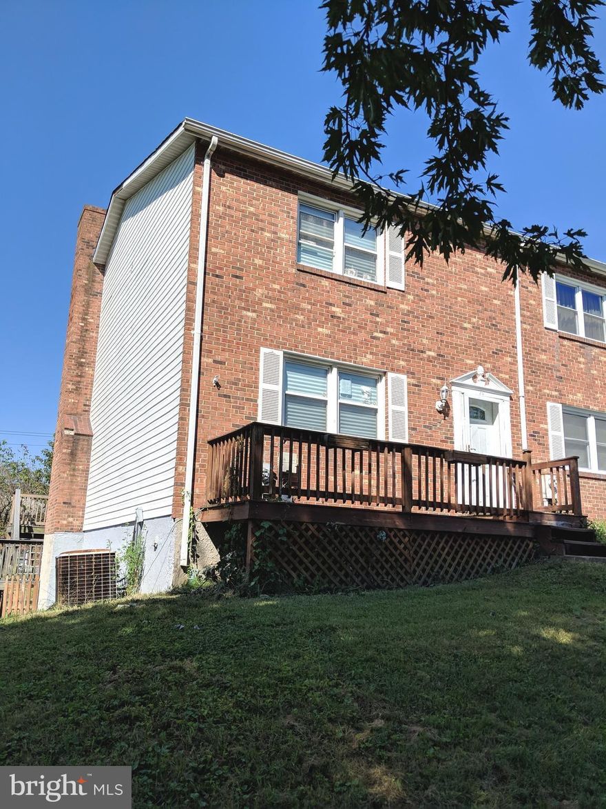 Opportunity awaits in this brick front end of group home in a super convenient location.  Expansive deck off the kitchen, walk-out partially finished lower level with fireplace, separate dining room, master bedroom half bath. Sold strictly as-is.  Seller will only accept cash or rehab loan offers. Buyer to pay all transfer and recordation taxes. Come see the potential!