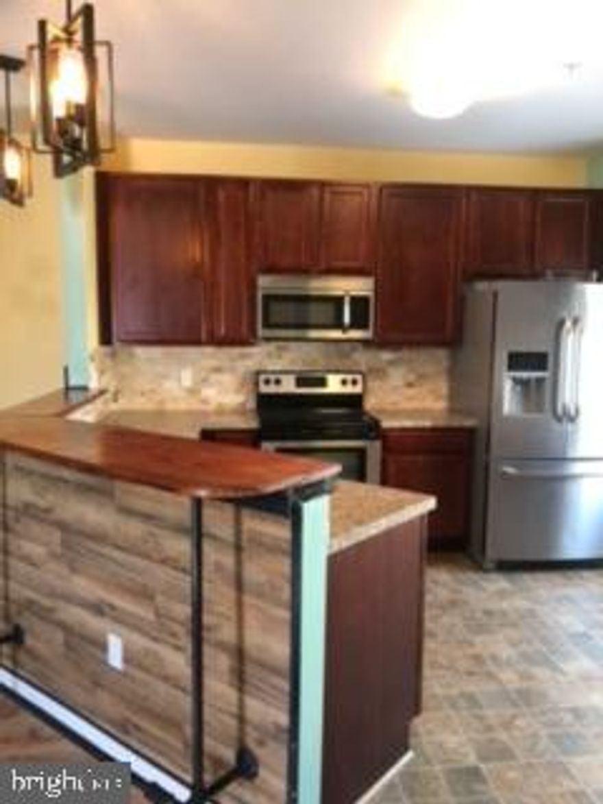 One of the largest Condos in St. Mary's County.  The Admiral has 2 good sized bedrooms and a den/office.   The kitchen has 42 in cabinets, stainless steel appliances and a beautiful backsplash, The den can be used as a flex space while you are working from home or as a dining room.  The condo has a lovely balcony.  This home comes with one of largest garages in the community with built in storage.  Condo has lulxury vinyl plank  flooring in the home.  The Primary bedroom has Shiplap as a design feature. An elevator in the building adds extra convenience.