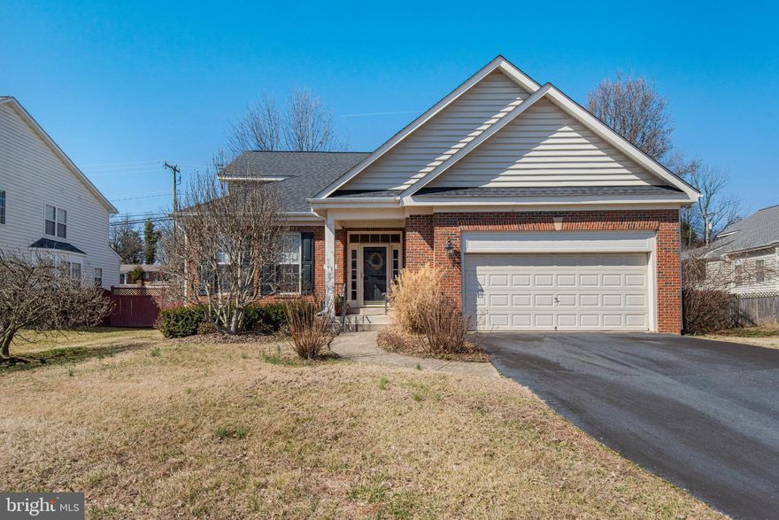 Main-Level Living with Open Floor Plan! Rare Opportunity in Burke – 
Tucked away in an exclusive enclave of Burke, this brick-front beauty offers a rarely available main-level primary suite and an expansive, open floor plan. Built in 2000—practically new for this sought-after area—this home boasts gleaming hardwood floors, vaulted ceilings, and elegant formal dining. The gourmet kitchen features granite countertops, a center island, and an eat-in area, leading to an enclosed porch—perfect for year-round enjoyment.
The spacious family room impresses with soaring ceilings and a cozy gas fireplace, creating a warm and inviting ambiance. A versatile den/office on the main level could easily serve as a second bedroom.
Upstairs, you’ll find two generous bedrooms, a full bath, and ample closet space. The unfinished lower level is a blank slate, tall ceilings, walk-up stairs to back yard, this area is ready for your vision—whether it’s additional living space, a recreation room, or extra storage.
Situated on a quiet cul-de-sac, this home is just minutes from VRE, Metro, Lake Braddock schools, shopping, dining, and the scenic trails of Burke Lake Park. Don’t miss this rare gem—schedule your private showing today!