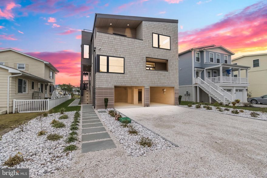 NEW PRICE!! Built by GRIT COASTAL! Welcome to waterfront luxury living at its finest in beautiful Fenwick Island! Nestled along the tranquil canals of this charming coastal community, this newly completed construction presents a rare opportunity to indulge in modern elegance and serene water views. Step inside this exquisite 5-bedroom (of which offers 2 owners suites, one on main level with private balcony and the 2nd owners suite on upper level), 4.5-bathroom home to discover an expansive floor plan designed with both comfort and sophistication in mind. The main level boasts a seamless flow from the spacious living area, perfect for entertaining guests, to the gourmet kitchen adorned with top-of-the-line appliances, sleek countertops, and ample storage space. Adjacent to the kitchen, a dining area awaits, offering an ideal setting for intimate dinners or festive gatherings. As you ascend the staircase, you'll find an upper level flex space, lavish owners suite overlooking the shimmering canal waters, providing a peaceful retreat to unwind and soak in the breathtaking sunsets. The luxurious en-suite bathroom features dual vanities a separate glass-enclosed tile shower, ensuring a spa-like experience every day. Additionally, three generously sized guest bedrooms, one of which having its own en-suite while the other 2  Bedrooms share a Jack and Jill bathroom, provide plenty of space for family and friends. Outside, the expansive decks/balconies totaling over 1,500 sqft including a roof top perch offers the perfect venue for al fresco dining, morning coffee, or simply basking in the coastal breeze while enjoying 360 panoramic views of the waterway. A rear gazebo overlooking the canal provides another unique space to entertain and relax by the water. With direct access to the canal, water enthusiasts can easily embark on boating adventures, paddle boarding excursions, or simply relax dockside and watch the world drift by. Conveniently located just moments away from pristine beaches, world-class dining, and endless recreational opportunities, this stunning canal front residence offers the epitome of coastal living.  New photos uploaded, home is completed now and ready to go.  Taxes are estimated. Home is partially and professionally staged and furniture may be available for purchase.  Rear property bulkhead may be extended into canal for more space if desired, with DNREC approval. Click virtual tour link for video.  Don't miss your chance to make this dream home your reality – schedule your private tour today!