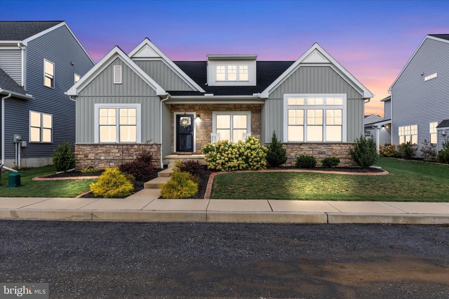 This stunning ranch home offers the ease of one-story living with an open, light-filled layout. The great room features vaulted ceilings with recessed lighting and stunning stone fireplace. The kitchen impresses with white cabinetry, stainless steel appliances, a large island, custom backsplash, quartz counters, and a built-in appliance lift for added convenience. The spacious owner’s suite includes detailed board and batten trim, large walk-in closet and a private bath. Enjoy outdoor living with a screened porch, fenced yard, and rear-entry garage. This home feature two additional bedrooms, another full bath, plantation shutters throughout, and many more upgrades—all in a prime location close to shopping, dining, and commuter routes.