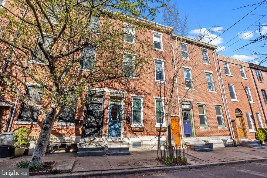 Welcome to 920 N. Orianna Street, a classic 1920 Philadelphia townhouse located in the heart of Northern Liberties on a picturesque, tree-lined street. This charming brick home offers the perfect blend of historic character and modern design, featuring stunning original details alongside sleek upgrades.
Step into the marble vestibule and you'll be greeted by a spacious living and dining area with original hardwood floors and high ceilings. Beyond the living room, a beautifully updated kitchen awaits, complete with stylish cabinetry, quartz countertops, and stainless steel appliances that include a Fisher & Paykel dishwasher and refrigerator. The kitchen looks out onto a delightful slate patio adorned with lush landscaping.  This oversized backyard oasis is an ideal retreat with ample space for entertaining, barbecuing, and relaxing.
The second-floor features three generously sized bedrooms with high ceilings and a newly renovated bathroom that tastefully blends modern amenities with nods to historical charm. Also on this level is a private terrace that overlooks the patio below.
On the third floor, you'll find a bright and sunny owner's suite, complete with a spacious bedroom, custom-designed closets, and a luxurious en-suite bathroom boasting a glass-enclosed shower and an oversized vanity fitted with Kohler fixtures. 
This home has a new roof with copper flashing, new hot water heater and new exterior doors that keep with the historic design elements.  Mini splits throughout the house keep you cool in the heat. 
Do not miss the chance to own a home close to everything this community has to offer.  It is located across the street from Orianna Hill Dog Park , around the corner from Liberty Lands and steps away from fantastic brunch and nightlife.  Walk to Fishtown, Old City and easy access to public transportation into Center City.