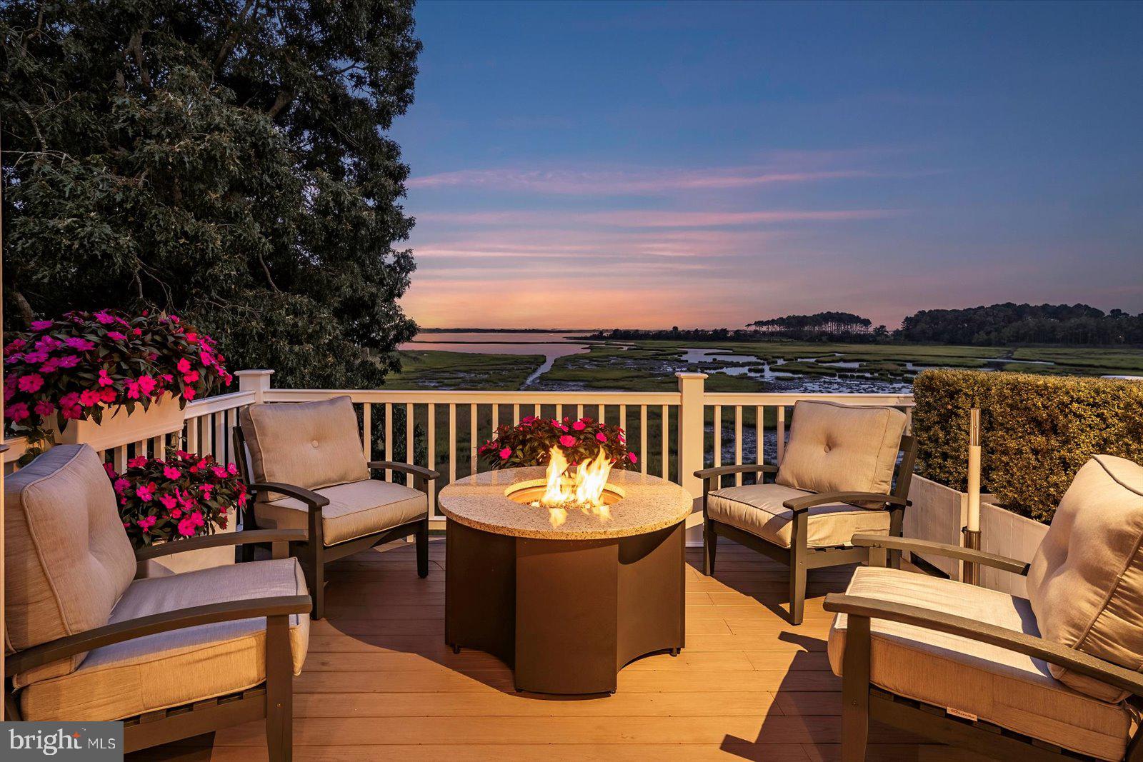 Grandeur at Its Peak – Stunning Views Overlooking Assateague Island
It all begins on the top floor, where panoramic views set the tone for this breathtaking home in the sought-after Ocean Reef community of West Ocean City. Expertly remodeled by Beachwood Builders, this 3-bedroom, 2.5-bath home spans approximately 3,150 square feet and offers luxury living with an emphasis on comfort, thoughtful design, and unforgettable entertaining spaces. The top-level great room is the heart of the home, where soaring windows frame captivating views of the bay and Assateague Island. Whether it’s the vibrant colors of sunset or a peaceful starry night, this space offers an ever-changing natural canvas. The great room flows seamlessly into a gourmet kitchen that is truly a chef’s dream. Outfitted with high-end appliances, rich leathered granite countertops, white cabinetry, a butcher block center island, and a cozy breakfast area, the kitchen is as functional as it is beautiful. Adjacent to the kitchen is the inviting family room with a warm fireplace, creating a cozy ambiance that works equally well for intimate evenings or lively gatherings. A dedicated dining area allows for memorable home-cooked meals shared with loved ones. Just outside, the upper deck is built for entertaining, complete with a custom-built, Marine-grade outdoor grill and kitchen area. Whether it’s crab feasts in summer or BBQs in the fall, this space is designed to be enjoyed year-round. A gas fire pit adds warmth and charm during cooler evenings. On the second level, the spacious primary suite is a private retreat, featuring water views and a spa-like en-suite bathroom. The luxurious bath includes a soaking freestanding tub, a walk-in tile shower, double sinks with vanities, and upscale finishes throughout. Two additional bedrooms on this level with one overlooking the water, one offering the flexibility to serve as a guest room or home office. The second-level deck offers another quiet space to relax and take in the sights and sounds of nature, from blue herons to gentle breezes. The lower level of the home includes a spacious garage with beautiful epoxy floors, as well as a finished "man cave" that’s perfect for entertaining. This area includes a pool table (which conveys), a dart board and a fun, laid-back atmosphere designed for unwinding. Outside, the landscaping is meticulous, with a long, elegant driveway that provides ample parking for guests. Whether you’re looking for a primary residence, a vacation home, or a peaceful sanctuary by the sea, this property offers the ideal blend of luxury, privacy, and convenience. Located in the highly desirable Ocean Reef community, this home is just minutes from the beach, boardwalk, top-rated restaurants, marinas, championship golf courses, the Ocean City Airport, the inlet, commercial harbor, and a variety of shopping options. Schedule your private showing today and experience firsthand what makes this coastal retreat so special.