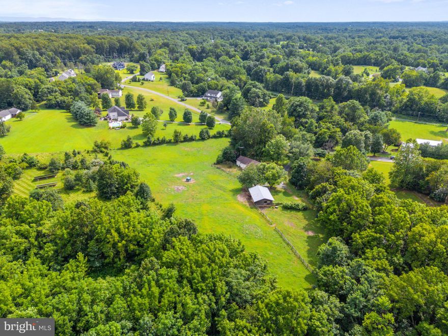NEW PRICE IMPROVEMENT!!!
Equestrian Paradise in the Sought-After Shepherdstown Area!  Tucked away in a private river-access community just minutes from Shepherd University, this horse-ready haven offers the lifestyle you’ve been dreaming of. Whether you're an equestrian enthusiast or simply craving wide open spaces, this property is designed for both you and your animals.

Bring your horses home and say goodbye to boarding fees! With two 12x12 stalls and one 12x8 stall, up to four fully fenced paddocks (including a fenced front/side yard), and a barn with electric and water access, your animals will feel right at home. The sliding barn door allows for easy access, and there's plenty of room to park your trailer thanks to the long driveway with ample parking.

Love to ride? This private community offers horse trail and ATV access, and permits equine and goats (no fowl or swine), making it a rare find in this highly desirable area.

Inside, the home features an open floor plan with luxury plank vinyl (LPV) flooring, an enclosed back porch, and handicap-accessible upgrades such as a ramped rear entry, first-floor bedroom, and walk-in shower with grab bars, making it perfect for multigenerational living or aging in place.
This is the perfect blend of comfort, convenience, and country living, just a short drive from downtown Shepherdstown and all its charm. *** Owner has an assumable FHA loan at 4.625%