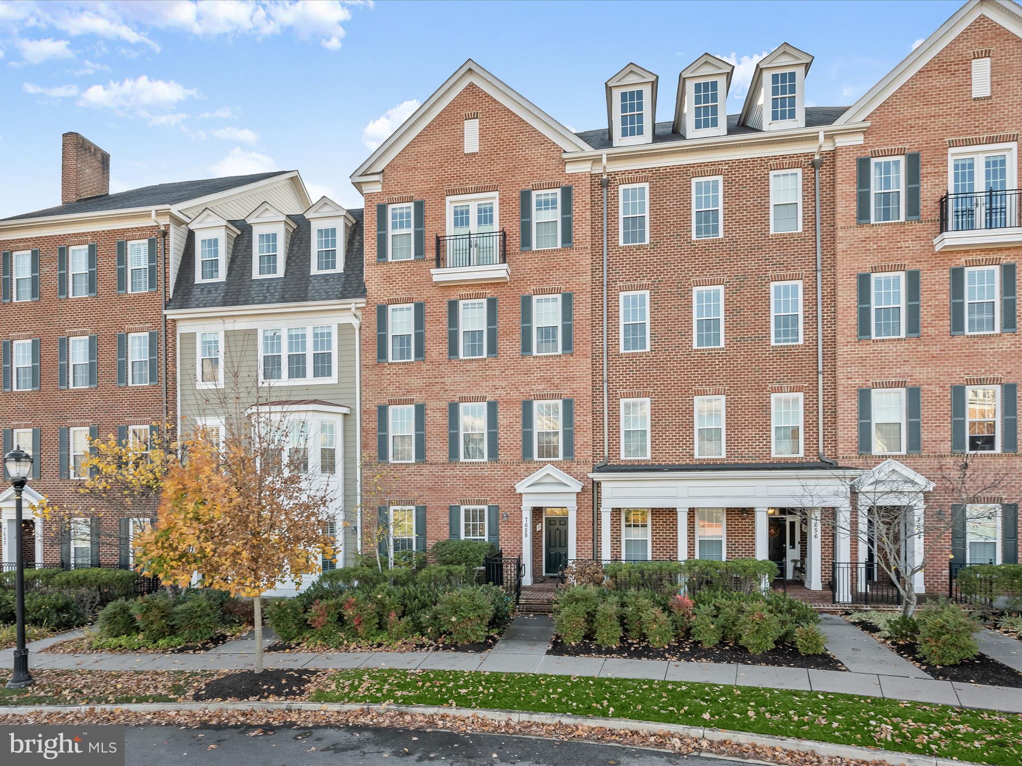 Welcome home to this beautifully designed luxury two-story condominium located in the desirable Midtown District of Maple Lawn! This prime location offers convenient access to the pool, gym, and community center right across the street. Enjoy pristine hardwood floors, bright interiors, crown moldings, and thoughtfully curated light fixtures throughout. The main level welcomes you with a spacious family room, large windows, a half bathroom and entry to the private attached garage. The upper level’s inviting living and dining areas and impressive windows provide the ideal spot for hosting gatherings. The kitchen is a chef's dream featuring granite countertops, 42” white shaker style cabinetry, stainless steel appliances, pendant lighting, and a breakfast bar. The primary suite is a tranquil retreat complete with a walk-in closet and luxurious bathroom featuring a beautifully refreshed large shower with dual shower heads and a dual sink vanity. An additional bedroom, full bath, and laundry area further enhance this exceptional home. Zoned for highly rated Howard County Schools, conveniently located close to all major Baltimore/DC commuter routes, and with enviable amenities including a resort-style community pool, tennis courts, pickleball courts, basketball courts, state-of-the-art gym and more, you’ll quickly see why Maple Lawn is one of the most sought-after communities in the region. Hurry! 7658 Maple Lawn Boulevard won’t last long.