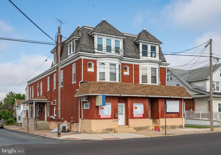 4600/4602 Kutztown Rd is a 6-Unit Mixed-Use Property. An excellent opportunity to own a well-maintained, income-producing property consisting of two connected brick buildings with a total of six units- five residential apartments and one commercial space.  The three apartments at 4600 Kutztown Rd are one-bedroom units, while 4602 Kutztown Rd features two spacious, full-floor, two-bedroom apartments. Two units include finished attic rooms for additional storage space. The basements are connected, offering mechanical areas plus a large finished space.  Each apartment is equipped with a refrigerator and stove, with one unit having in-unit laundry and a shared laundry room available for the others. Every unit has its own heat and air conditioning, paid by the tenants. The landlord covers water, sewer, trash, and common area electric.  This commercial property has been well cared for and was previously home to the owner’s inspection business. Updates have been periodically completed throughout the property, including a significant renovation of the first-floor apartment at 4602. Additional features include a rear parking lot with potential for added income, and a security monitoring system with indoor and outdoor cameras (included in sale). Convenient location near shopping, restaurants, public transportation, and area amenities. This is a rare opportunity to acquire a solid, locally owned, and well-kept mixed-use property with established rental income. Interior pictures taken before while vacant. 
Professional interior pictures will be added by 9/18.