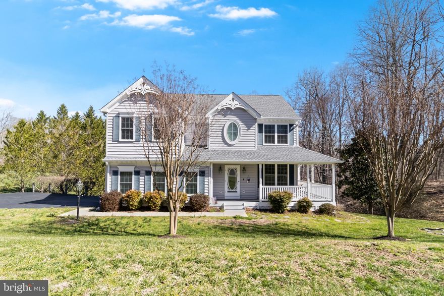 Nestled in the peaceful Sunderleigh neighborhood of Sunderland, Maryland, this stunning two-story colonial sits on a spacious lot, offering a perfect blend of elegance and comfort. A welcoming wraparound front porch extends along the side, providing a second entrance into the cozy Dining room/Den. The asphalt driveway leads to a convenient side-load garage, adding both function and curb appeal.  

Step inside to a grand two-story foyer with an office just to the right, ideal for those working from home. Beautiful hardwood floors flow throughout the foyer, den, kitchen, and breakfast nook, creating a warm and inviting atmosphere. The gourmet kitchen is a chef’s dream, featuring granite countertops, stainless steel appliances—including a refrigerator with a water and ice maker, a microwave, two double ovens, a dishwasher—and a stunning furniture-style island with a marble top. The extended breakfast nook offers ample space for casual dining and opens to an enclosed porch, with additional access to the formal dining room.  

The sunken living room is a showstopper, featuring a gas fireplace with a custom entertainment center, complete with retractable doors above the mantel. A conveniently located half bath completes the main level.  

The finished basement is an entertainer’s paradise, boasting a full bar, built-in surround sound system, and a cozy free-standing wood stove. A door leads to an enclosed patio with a concrete floor, providing additional outdoor living space. A water filtration and softener system ensures pristine water quality throughout the home.  

Upstairs, the luxurious master suite is a true retreat, accessed through double doors and offering two walk-in closets, a private sitting area, and an open, airy feel. The spa-like master bath includes ceramic flooring, a walk-in shower, an oval soaking tub, and dual vanities. The conveniently located second-floor laundry room comes fully equipped with a washer and dryer. Three additional spacious bedrooms complete the upper level, offering plenty of room for family and guests.  

This exquisite home in Sunderleigh offers the perfect balance of privacy, space, and modern conveniences. Schedule your private showing today and experience all that this remarkable property has to offer!