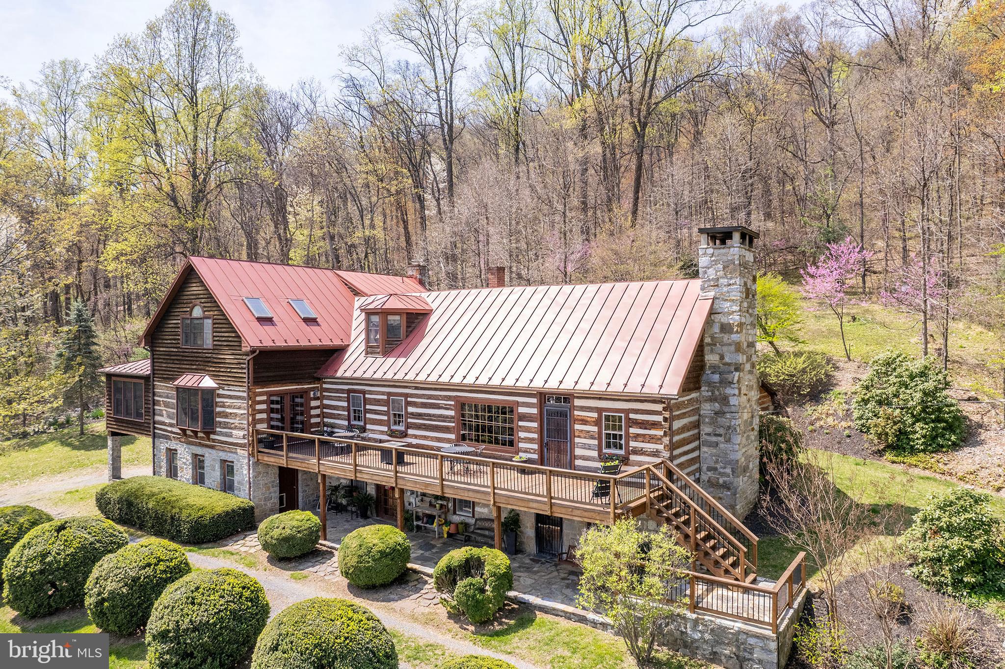 Escape to Your Private Retreat – Just 10 Minutes from Winchester!
Don’t miss the 3D tour attached to this listing!
Welcome to a truly one-of-a-kind property offering 27.65 secluded acres across three parcels, complete with towering trees, a tranquil pond, and breathtaking natural surroundings. This charming log home is rich with character and history—originally relocated here in the 1960s, with a thoughtfully designed three-story addition completed in 1994.
Step inside and be greeted by the warmth of exposed wood beams, a cozy fireplace, and the inviting feel of a classic cabin paired with modern comforts. The spacious kitchen, perfect for entertaining, features solid cherry cabinetry, quartz countertops, and an induction cooktop.
A true highlight is the sunroom, added in 2007—complete with radiant heated floors, a wood-paneled ceiling, and its own heating/cooling unit—where you can enjoy year-round views of your serene surroundings.
Upstairs, the primary suite offers stunning views and a private ensuite bath. Two additional bedrooms and a convenient laundry room complete the upper level.
Outdoors, you’ll love the expansive deck, perfect for gatherings or peaceful mornings. Enjoy seasonal blooms, mature plantings, and a wood stove for those crisp winter evenings. The walkout basement offers even more space with a mudroom, a large recreation room with fireplace, exposed beams, ample storage, and a mechanical room.
Recent Updates Include:
New A/C system (2024)
Kitchen refresh (2022)
Eco Water iron filter (2018; rebedded 2025)
Standing seam metal roof (2013)
Septic pumped (2024)
Electric fence to protect landscaping from deer
Located just off Routes 37 and 50, this unique property delivers the perfect balance of privacy and accessibility.
Three included parcels:
6.15 acres – Tax ID: 61-A-70
10.50 acres – Tax ID: 61-A-63
11.00 acres – Tax ID: 61-A-65
Schedule your private showing today—this one is truly a rare gem.
